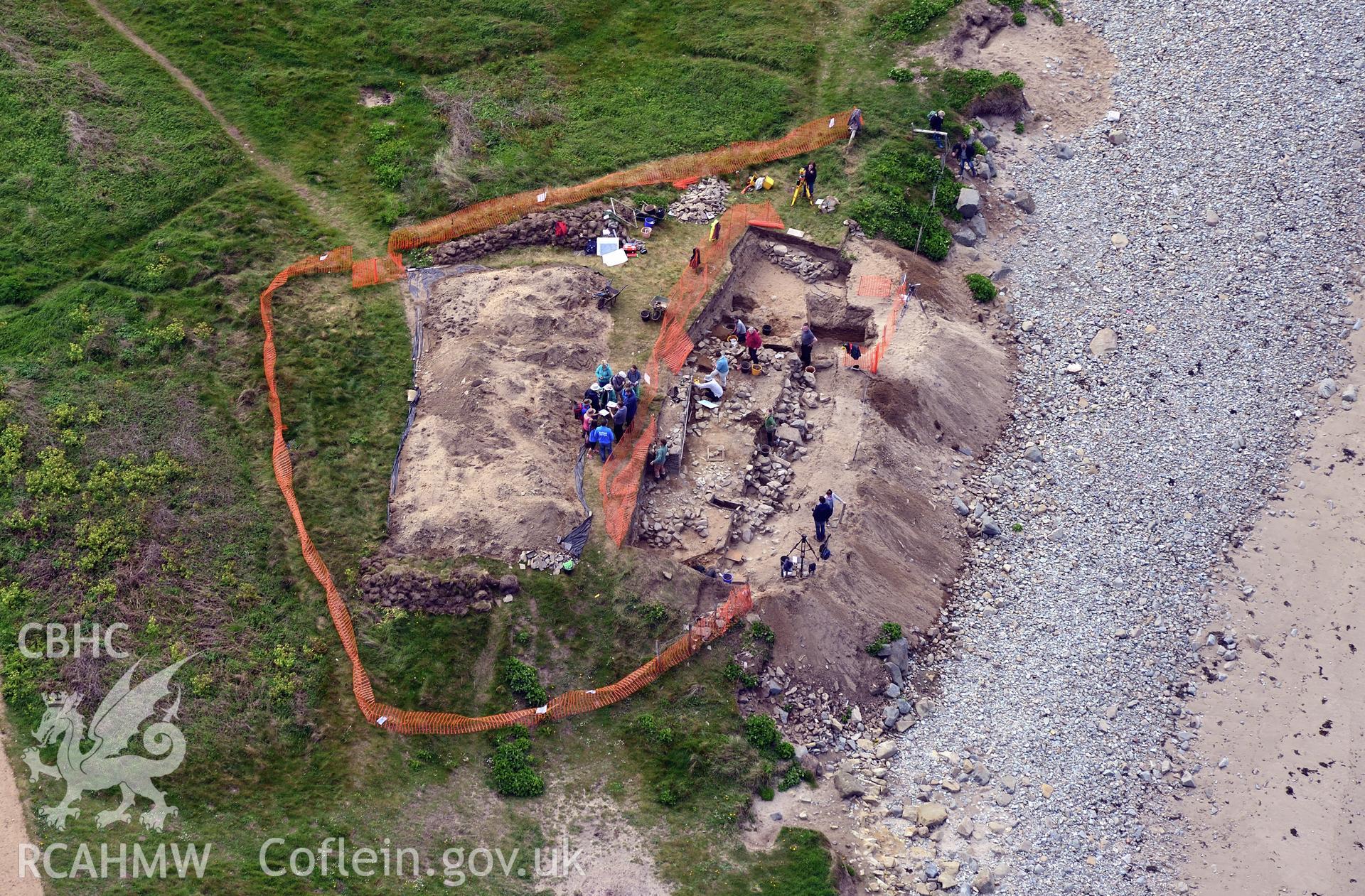 Dyfed Archaeological Trust excavating site of St. Patrick's chapel at Whitesands Bay. Oblique aerial photograph taken during the Royal Commission's programme of archaeological aerial reconnaissance by Toby Driver on 13th May 2015.