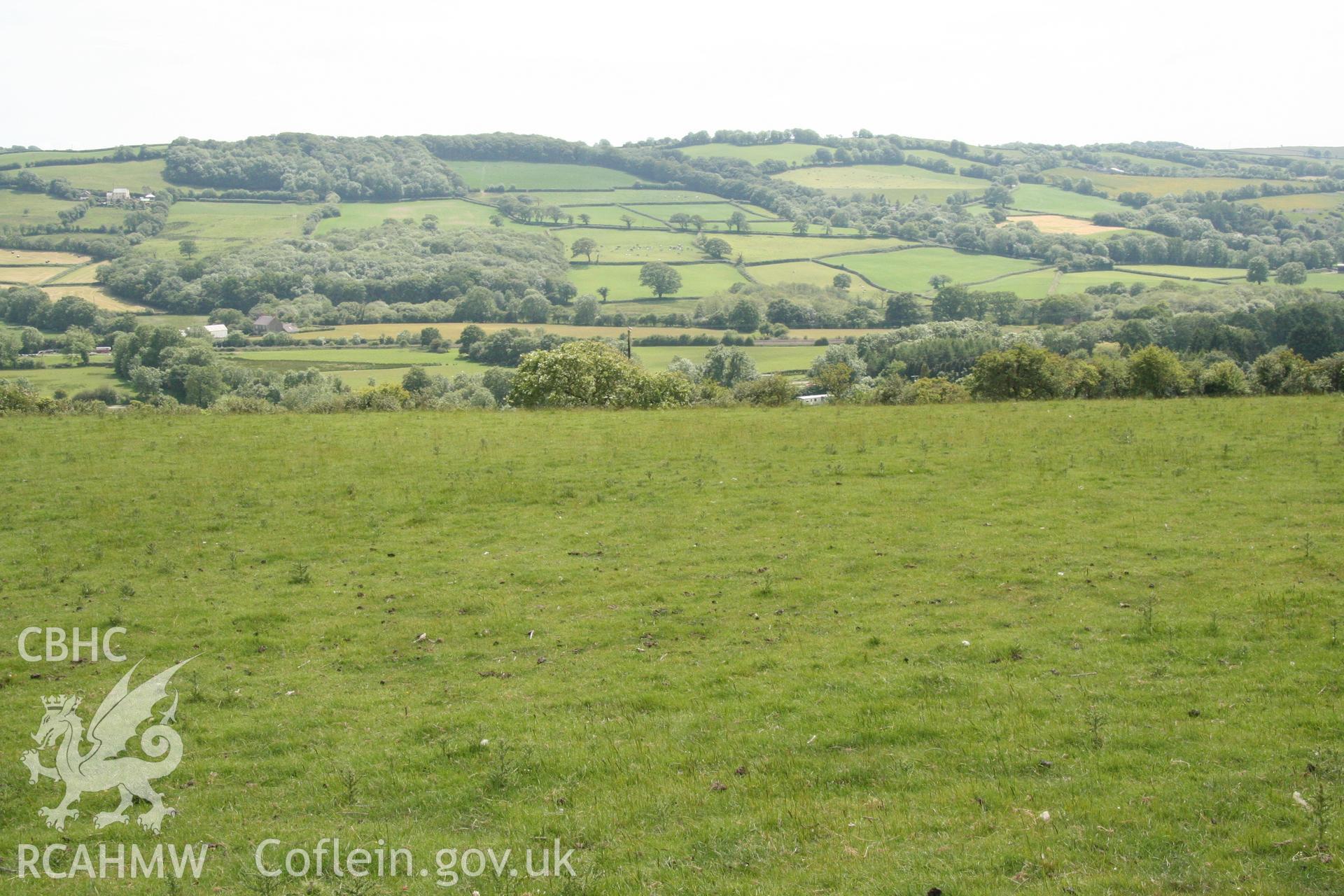 View from interior of enclosure at Castell y Gaer looking south towards proposed site. Photographed as part of Archaeological Appraisal of Land at Llethrach Newydd, Llysonnen Road, Bancyfelin, Carmarthenshire, carried out by Archaeology Wales, 2015.