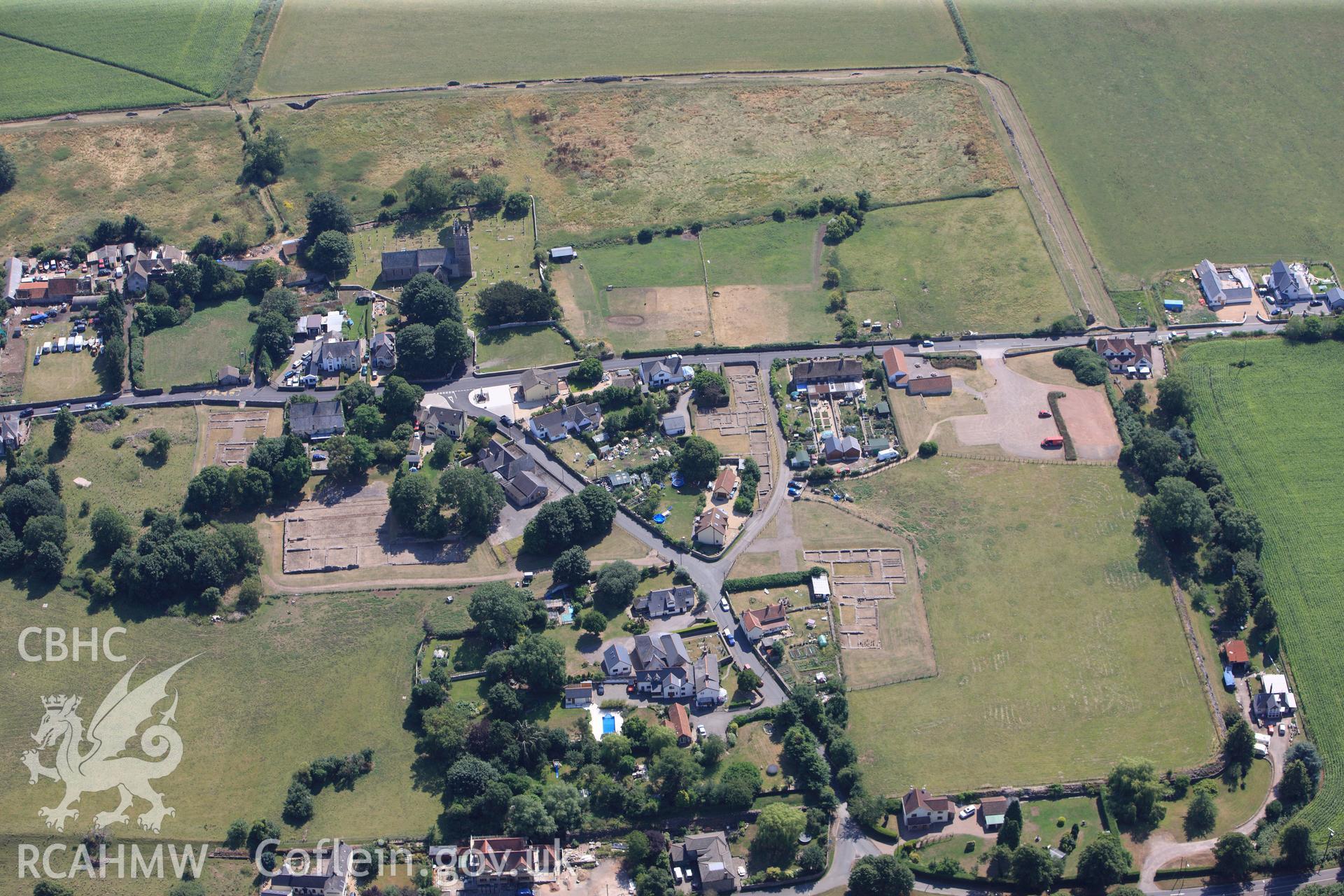 St. Stephen's church, Roman Amphitheatre, Roman Temple and Venta Silurum (Caerwent Roman City), Caerwent, near Chepstow. Oblique aerial photograph taken during the RCAHMW?s programme of archaeological aerial reconnaissance by Toby Driver, 1st August 2013.