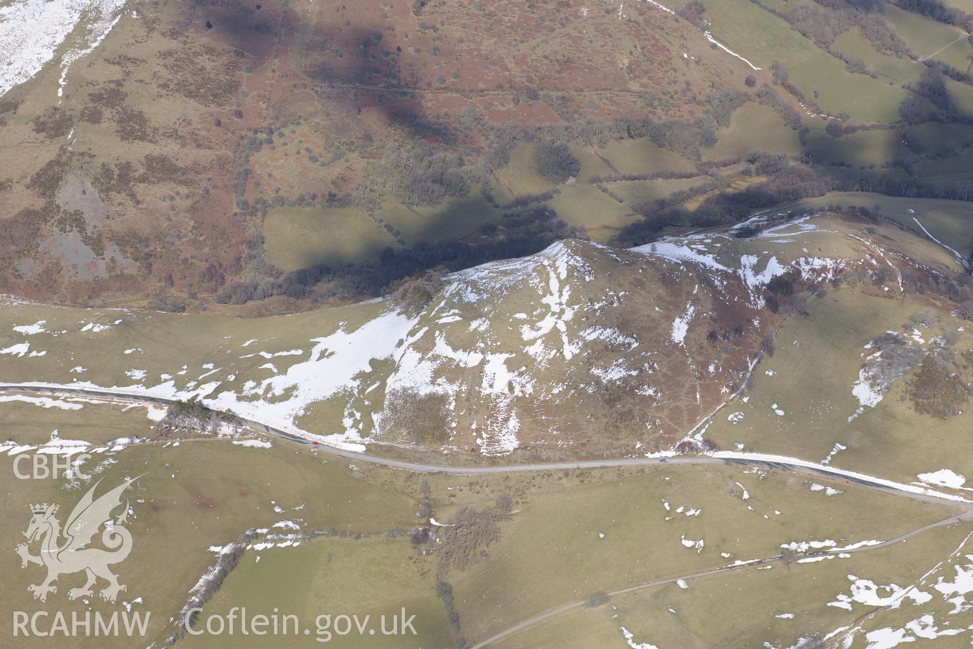 Pen-y-Clun hillfort or defended enclosure, south west of Trefeglwys. Oblique aerial photograph taken during the Royal Commission's programme of archaeological aerial reconnaissance by Toby Driver on 2nd April 2013.