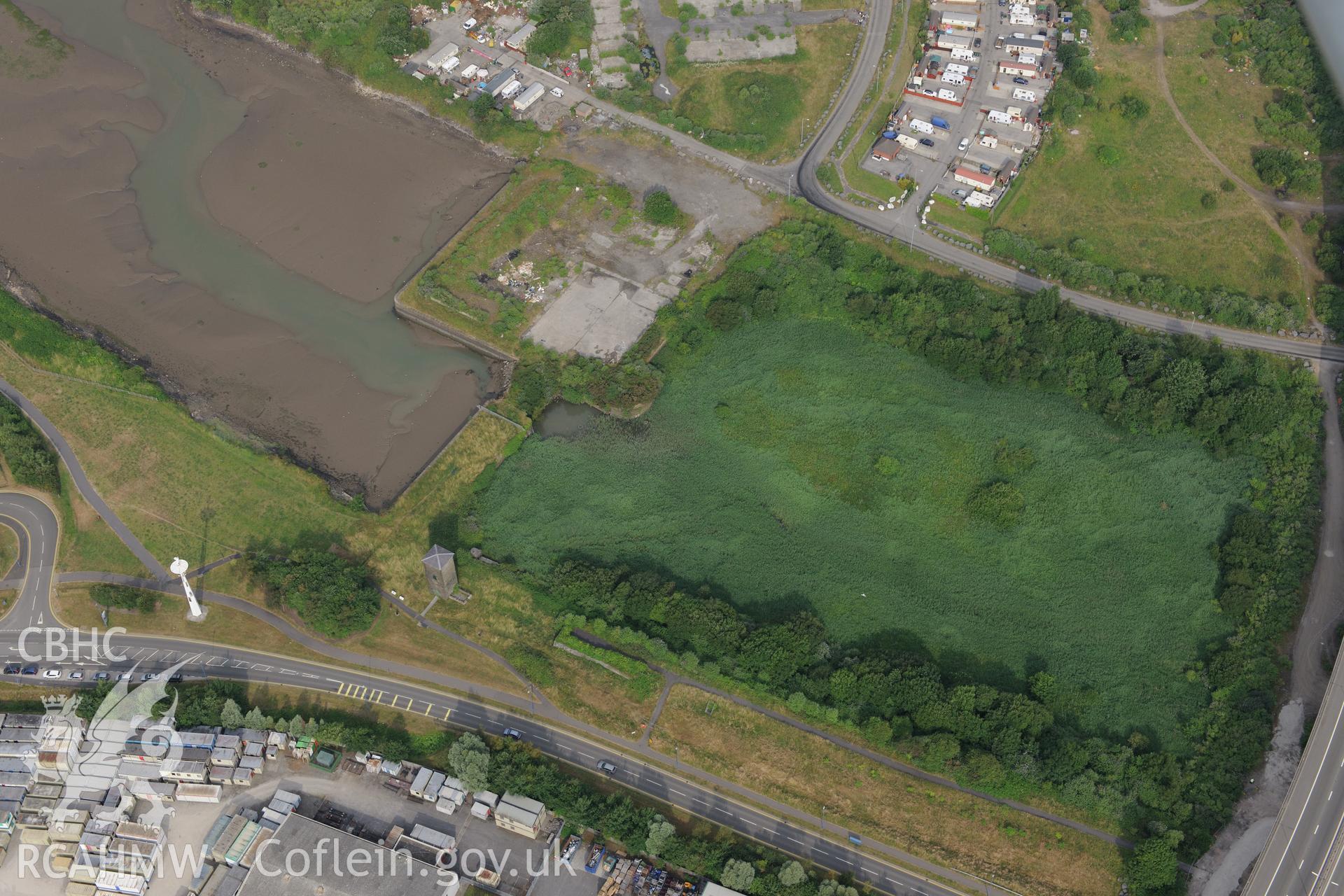 Royal Commission aerial photography of Briton Ferry Dock recorded during drought conditions on 22nd July 2013.