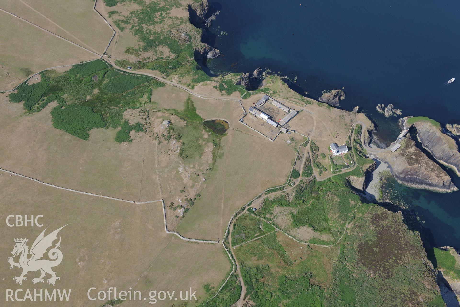 Ramsey Island Farm and pond, on Ramsey Island. Oblique aerial photograph taken during the Royal Commission?s programme of archaeological aerial reconnaissance by Toby Driver on 16th July 2013.