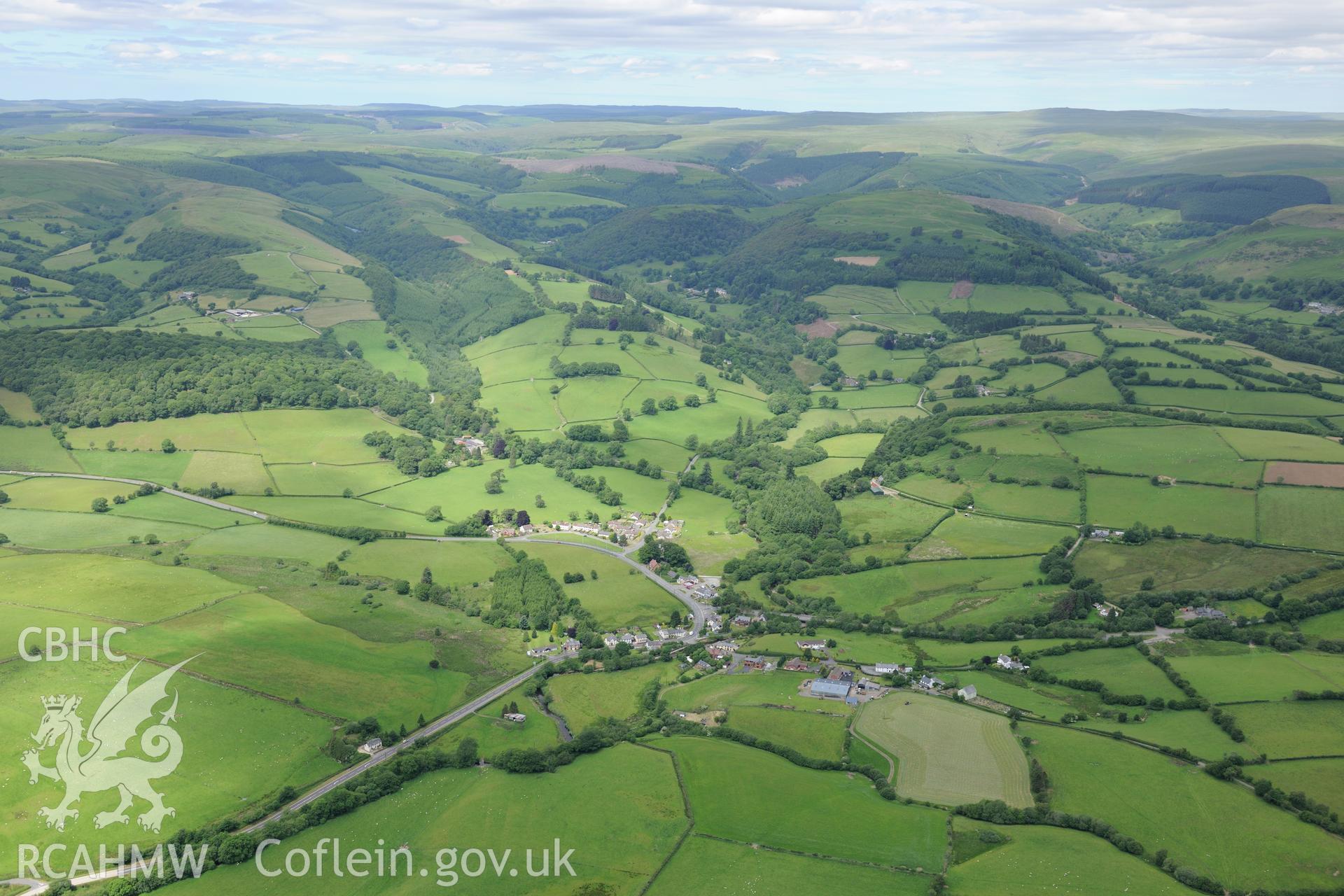 The village of Beulah, west of Builth Wells. Oblique aerial photograph taken during the Royal Commission's programme of archaeological aerial reconnaissance by Toby Driver on 30th June 2015.