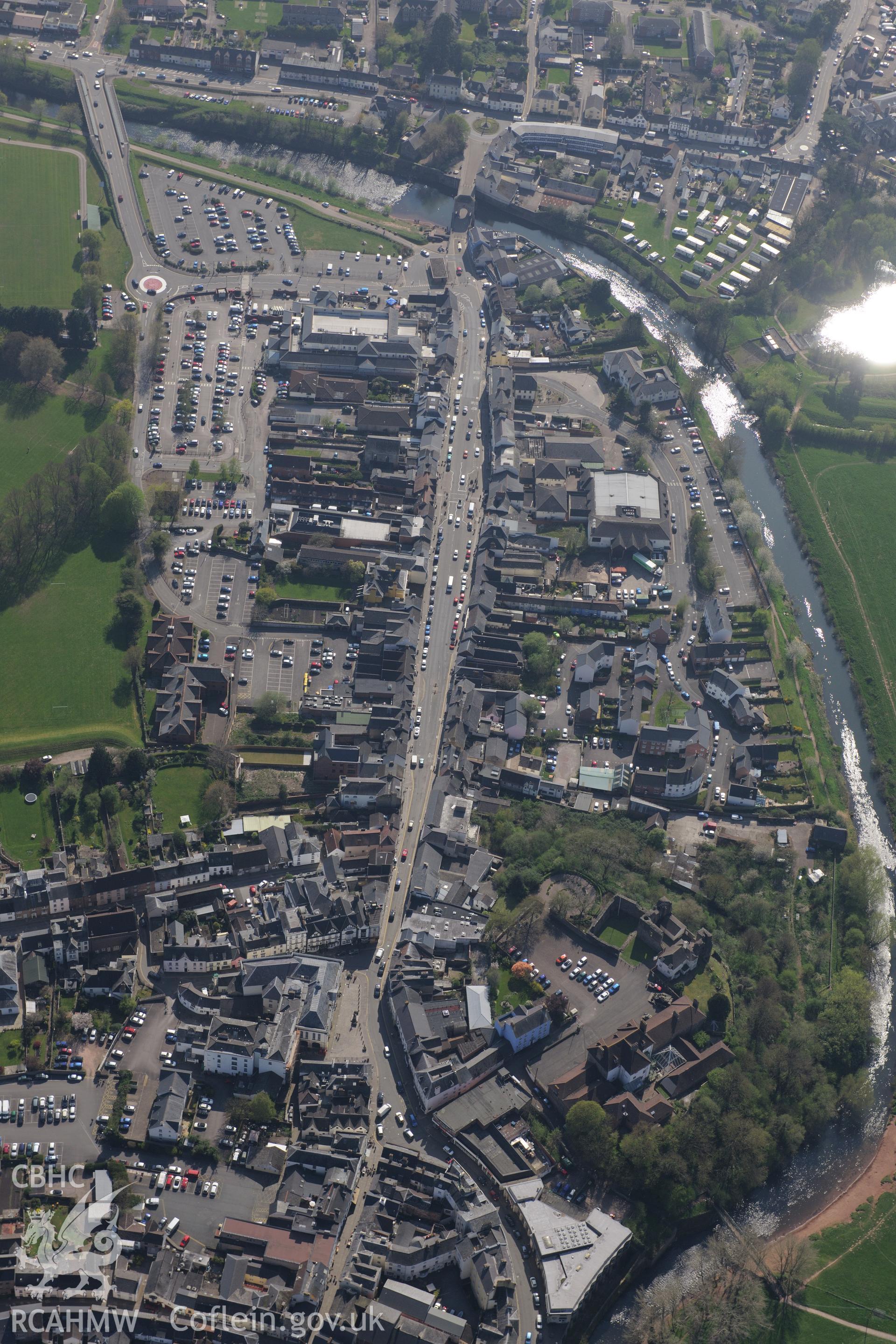 Monmouth including views of the Castle; Great Castle House; Drybridge House Walled Garden and Chippenham Commom. Oblique aerial photograph taken during the Royal Commission's programme of archaeological aerial reconnaissance by Toby Driver on 15th April 2015.