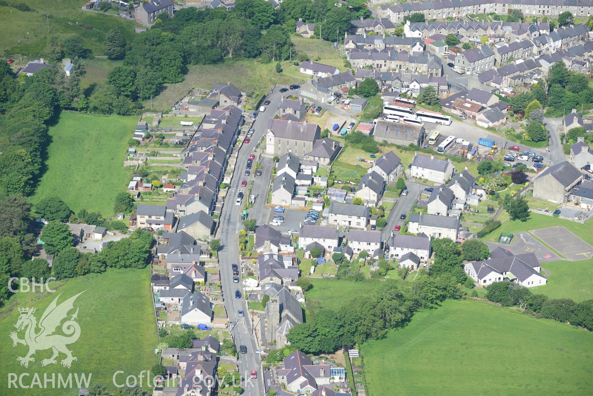 Maesyneuadd Welsh Independent Chapel, St. George's Church and the village of Trefor. Oblique aerial photograph taken during the Royal Commission's programme of archaeological aerial reconnaissance by Toby Driver on 23rd June 2015.