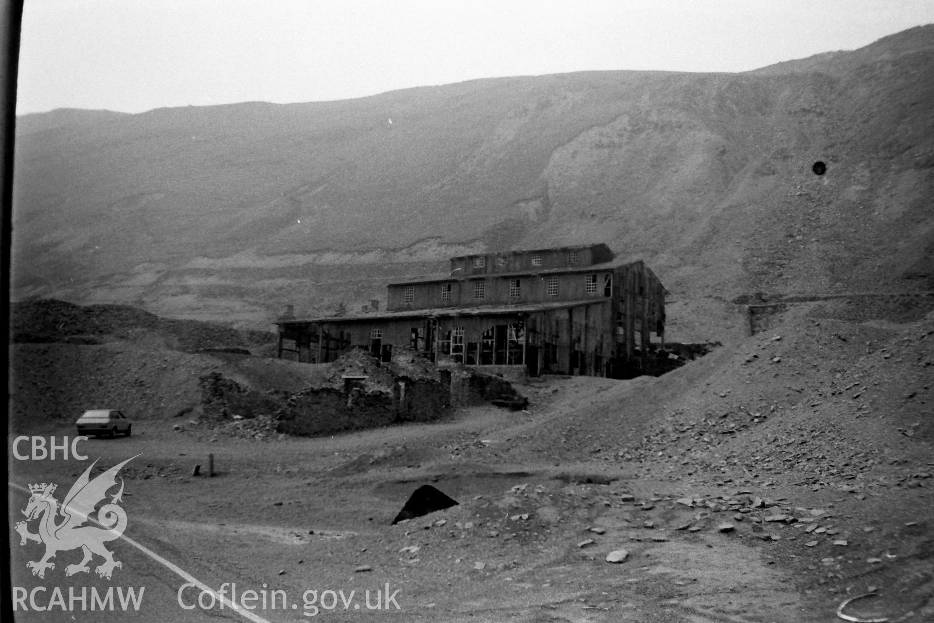 Digitised black and white photograph showing front elevation of the old dressing mill at Cwmystwyth lead mine. Photographed by Martin Davies as part of his Bachelor of Architecture dissertation from the University of Nottingham, 1979.