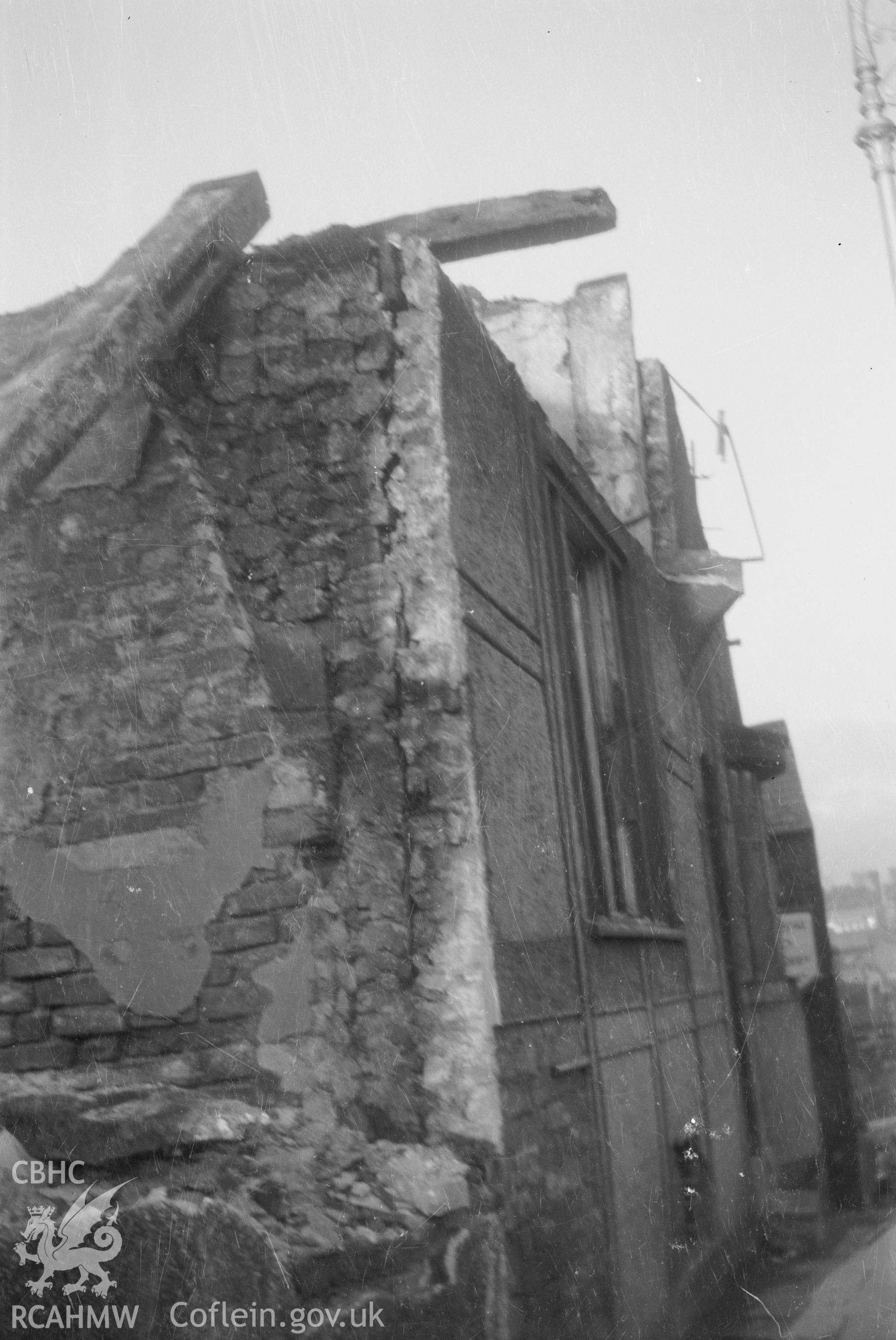 Digital copy of a nitrate negative showing an unidentified building in Wrexham - demolition in progress, taken by RCAHMW.