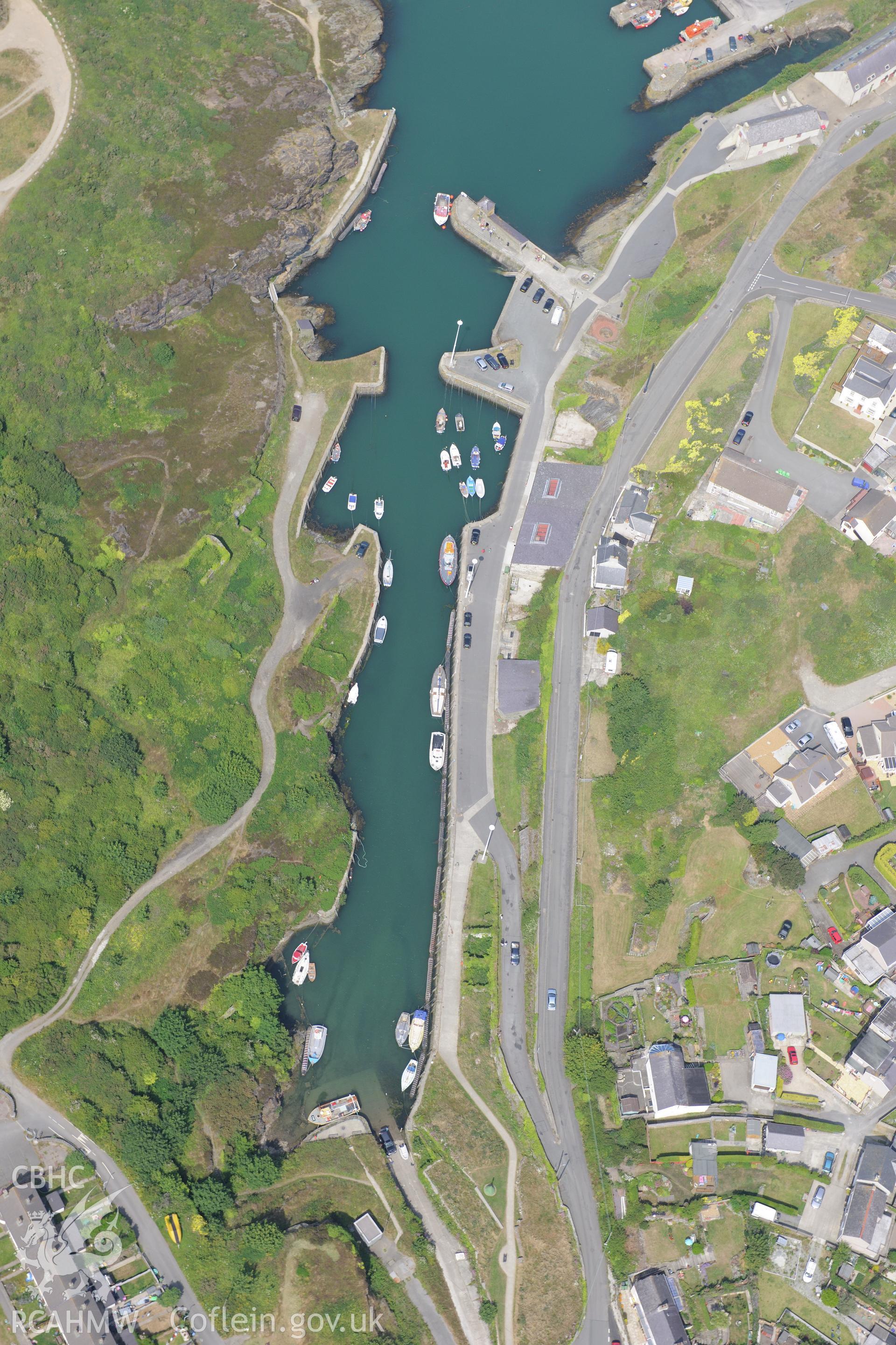 Amlwch harbour, Anglesey. Oblique aerial photograph taken during the Royal Commission?s programme of archaeological aerial reconnaissance by Toby Driver on 12th July 2013.