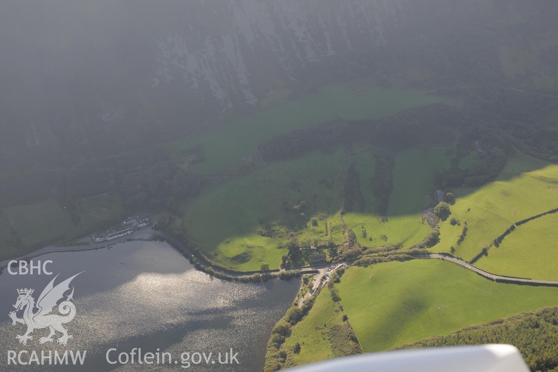 St. Mary's church, Ty'n-y-Cornel Hotel & Tal-y-Llyn enclosure or Roman fortlet, on shore of Tal-y-Llyn lake, Corris. Oblique aerial photograph taken during Royal Commission's programme of archaeological aerial reconnaissance by Toby Driver on 2/10/2015.