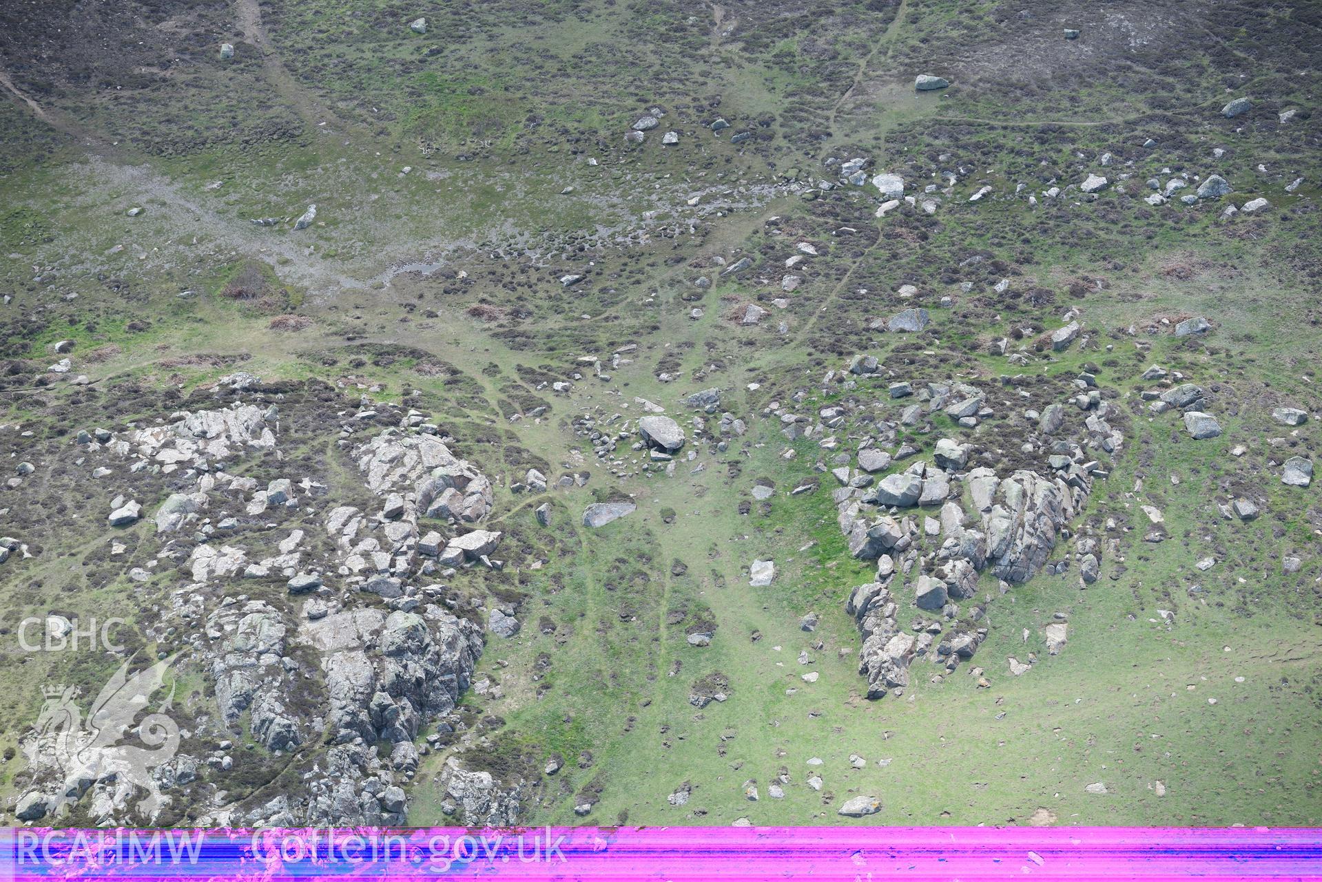 Coetan Arthur burial chamber, St. David's Head. Oblique aerial photograph taken during the Royal Commission's programme of archaeological aerial reconnaissance by Toby Driver on 13th May 2015.