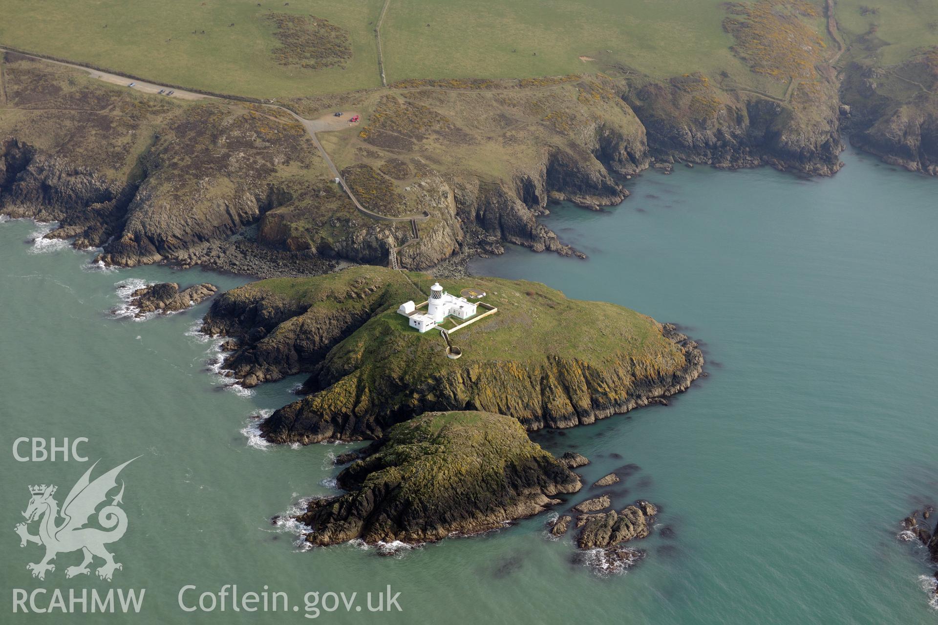 Aerial photography of Strumble Head lighthouse taken on 27th March 2017. Baseline aerial reconnaissance survey for the CHERISH Project. ? Crown: CHERISH PROJECT 2017. Produced with EU funds through the Ireland Wales Co-operation Programme 2014-2020. All material made freely available through the Open Government Licence.