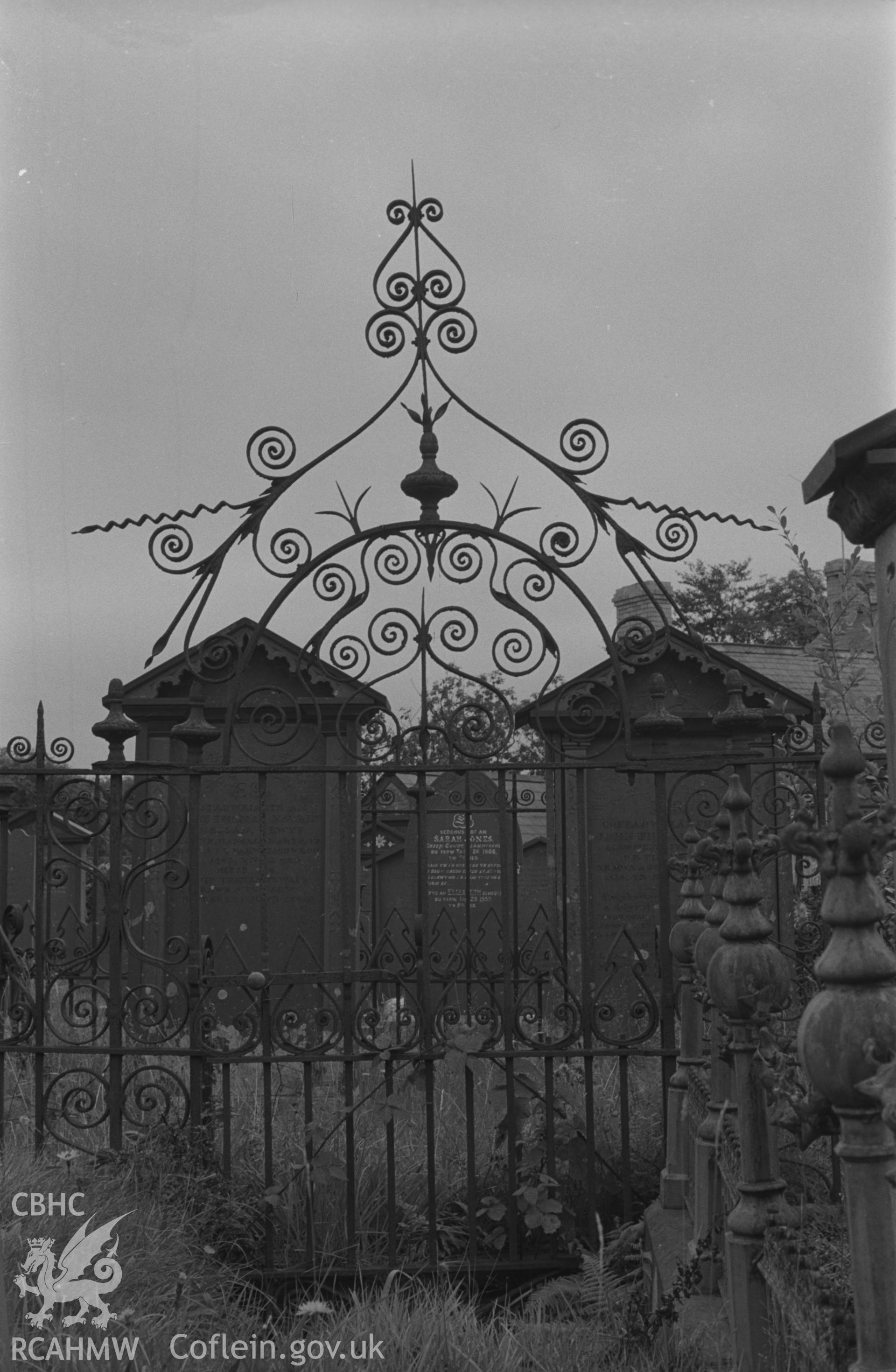 Digital copy of a black and white negative showing wrought iron gates at Capel Pant-y-Defaid Welsh Unitarian chapel, Pren-Gwyn, Llandysul. Photographed by Arthur O. Chater on 7th September 1966.