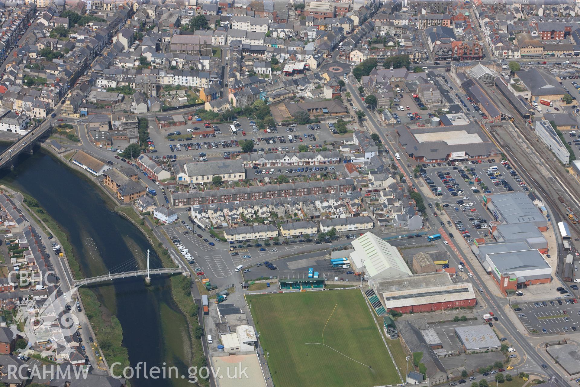 View of Aberystwyth including railway station, Yr Hen Ysgol Gymraeg, Trefechan Bridge, Rheidol Footbridge & town Football Ground. Oblique aerial photograph taken during RCAHMW?s programme of archaeological aerial reconnaissance by Toby Driver, 12/07/2013.