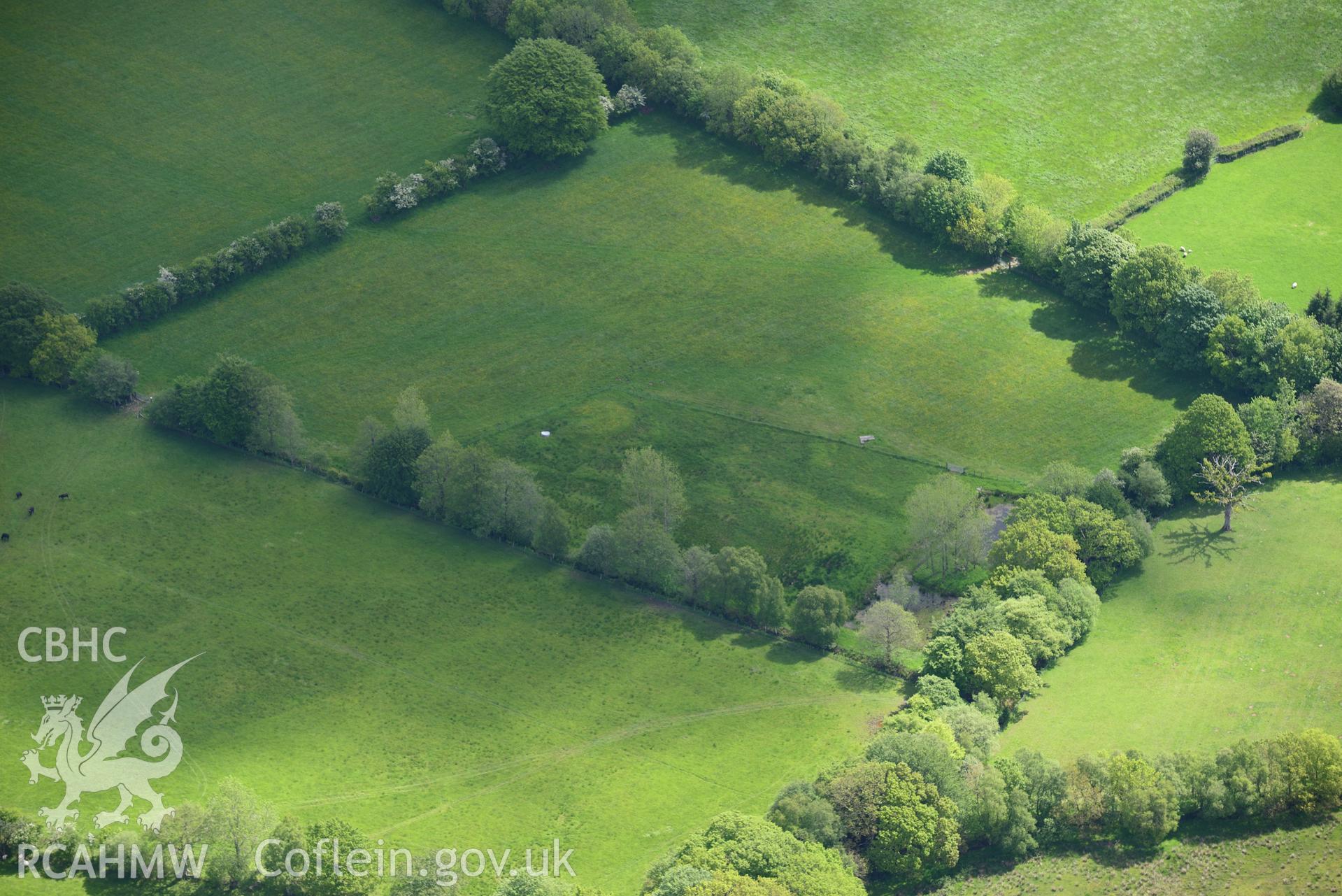 Burnt mound north of Glanrhocca. Oblique aerial photograph taken during the Royal Commission's programme of archaeological aerial reconnaissance by Toby Driver on 3rd June 2015.