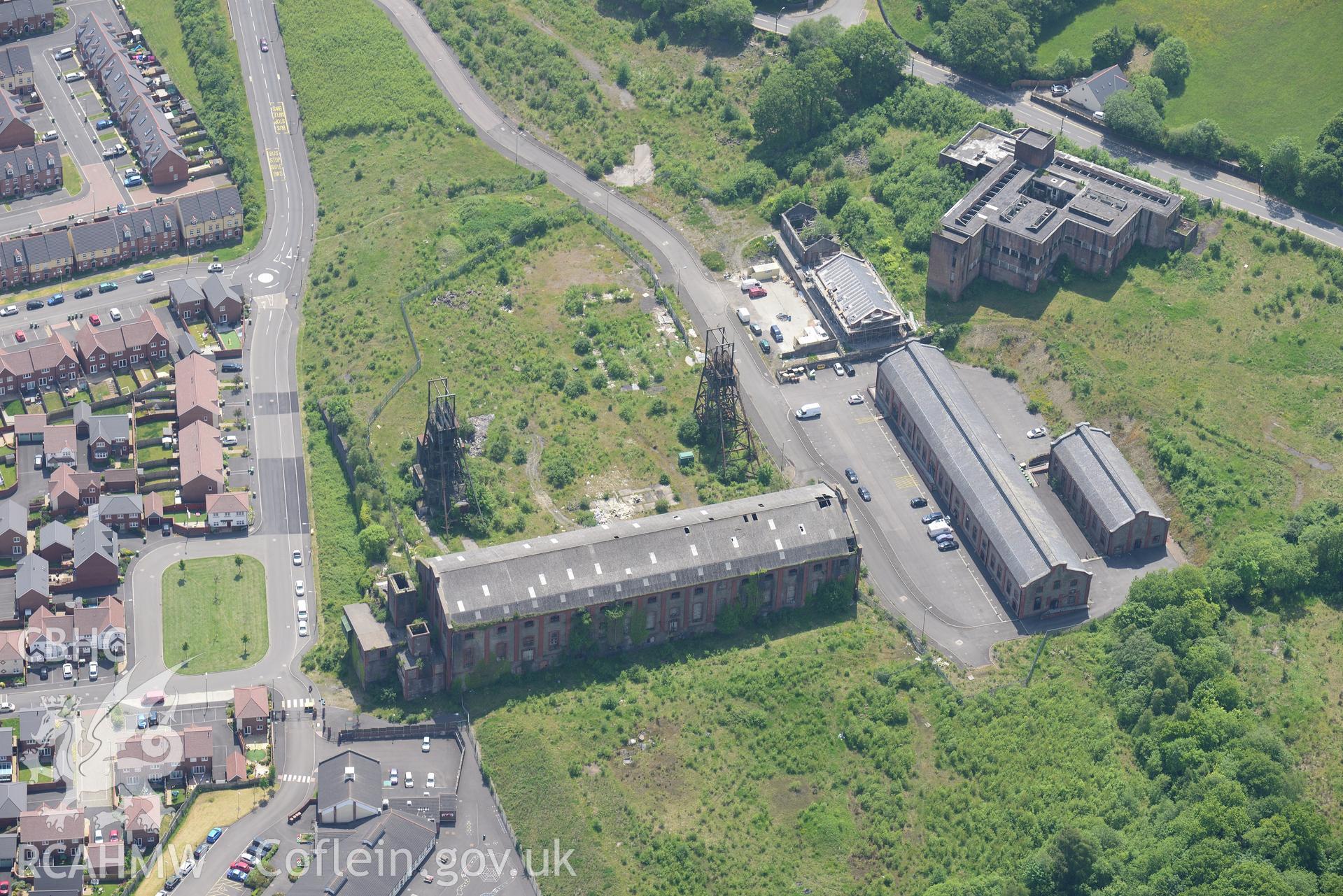 Penallta Colliery, Ystrad Mynach, including views of headframe shafts no. 1 and 2; pithead baths and canteen, powerhouse and workshops. Oblique aerial photograph taken during the Royal Commission's programme of archaeological aerial reconnaissance by Toby Driver on 11th June 2015.