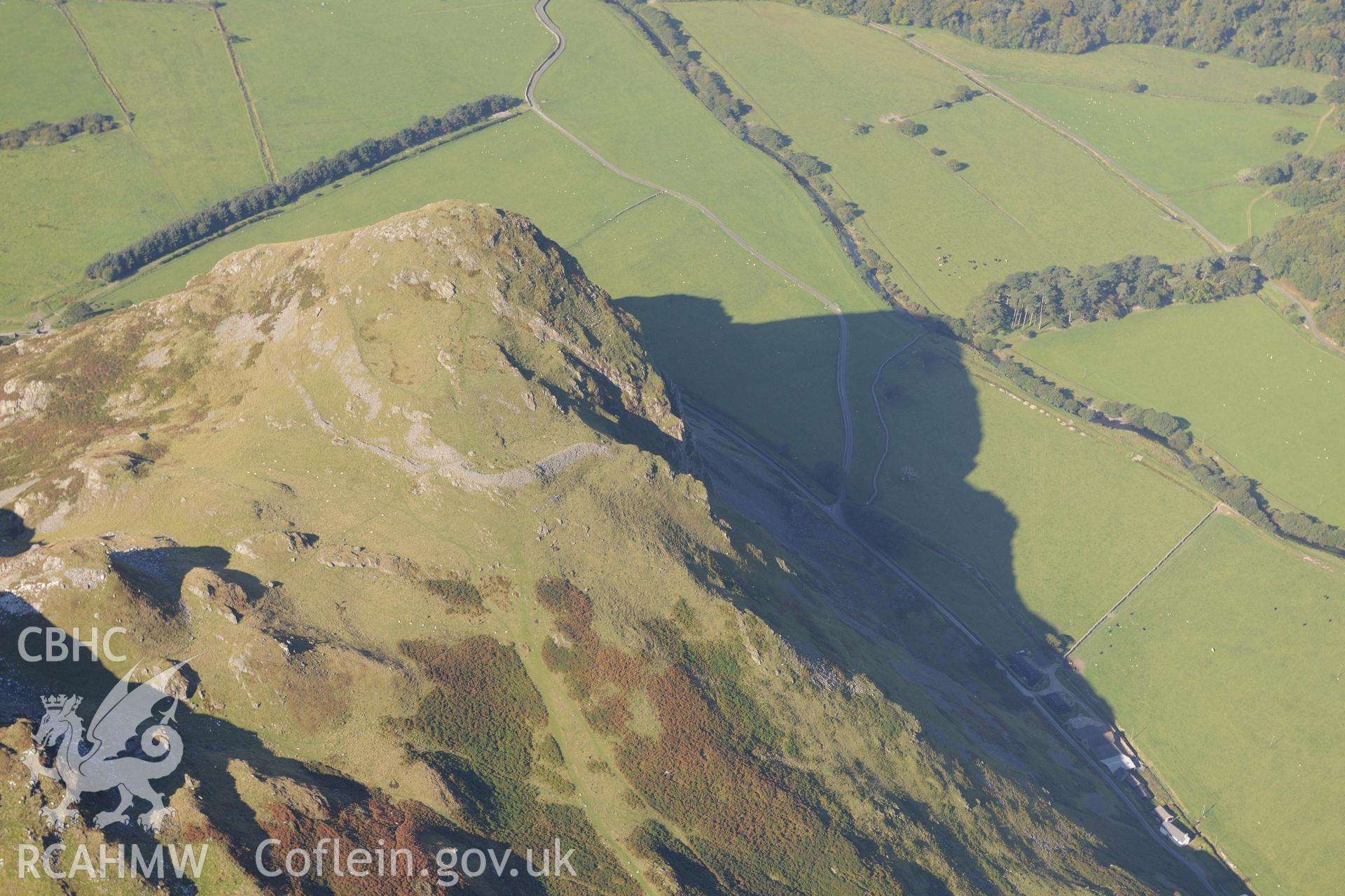 Hillfort on Bird's Rock, near Abergynolwyn. Oblique aerial photograph taken during the Royal Commission's programme of archaeological aerial reconnaissance by Toby Driver on 2nd October 2015.