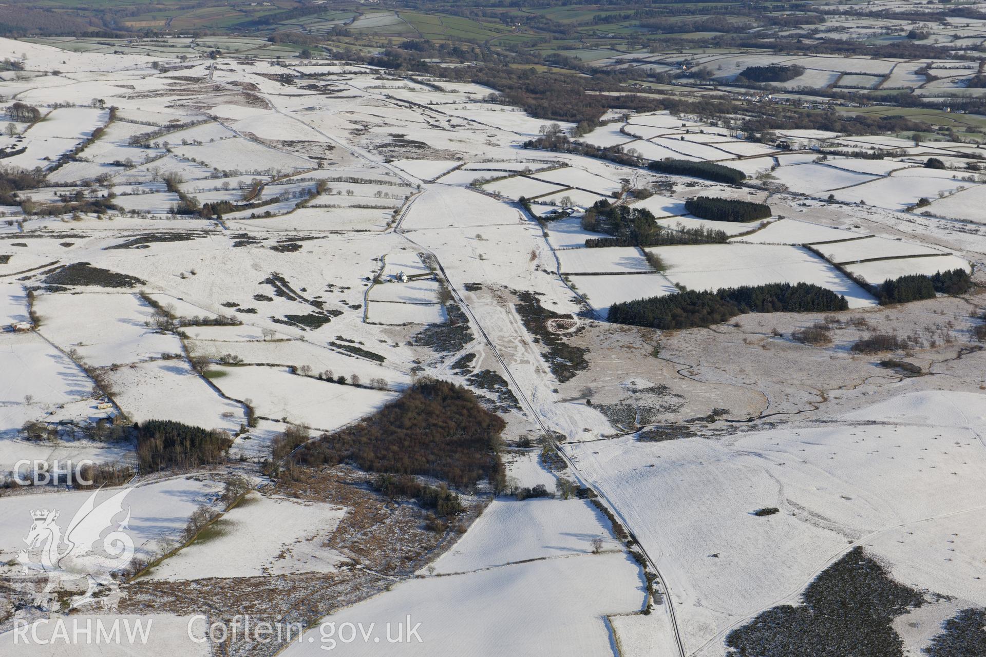 The south western section of the Roman road on Mynydd Illtyd, south west of Brecon. Oblique aerial photograph taken during the Royal Commission?s programme of archaeological aerial reconnaissance by Toby Driver on 15th January 2013.