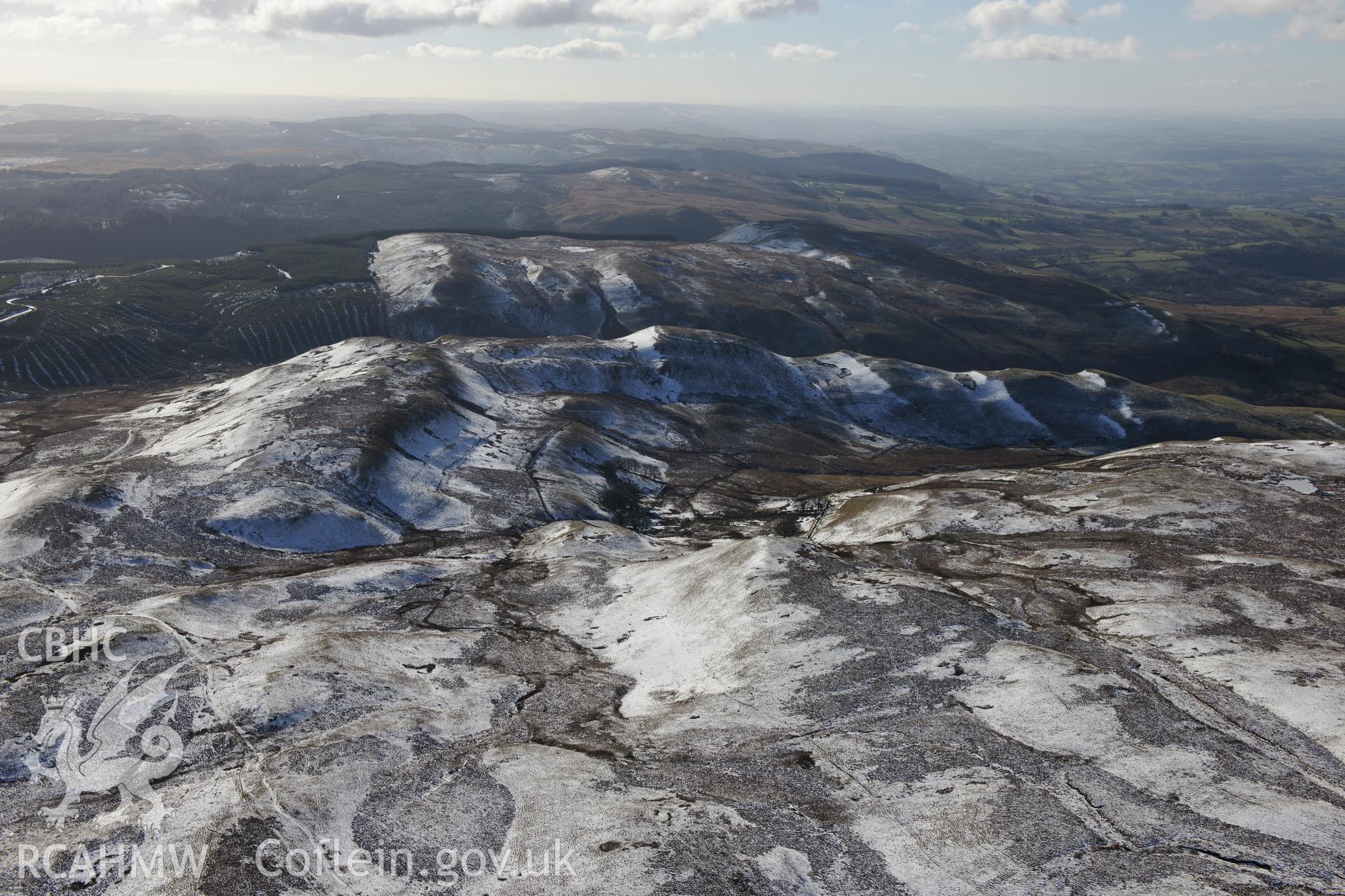 Long view of Castell Rhyfel hillfort from the north. Oblique aerial photograph taken during the Royal Commission's programme of archaeological aerial reconnaissance by Toby Driver on 4th February 2015.