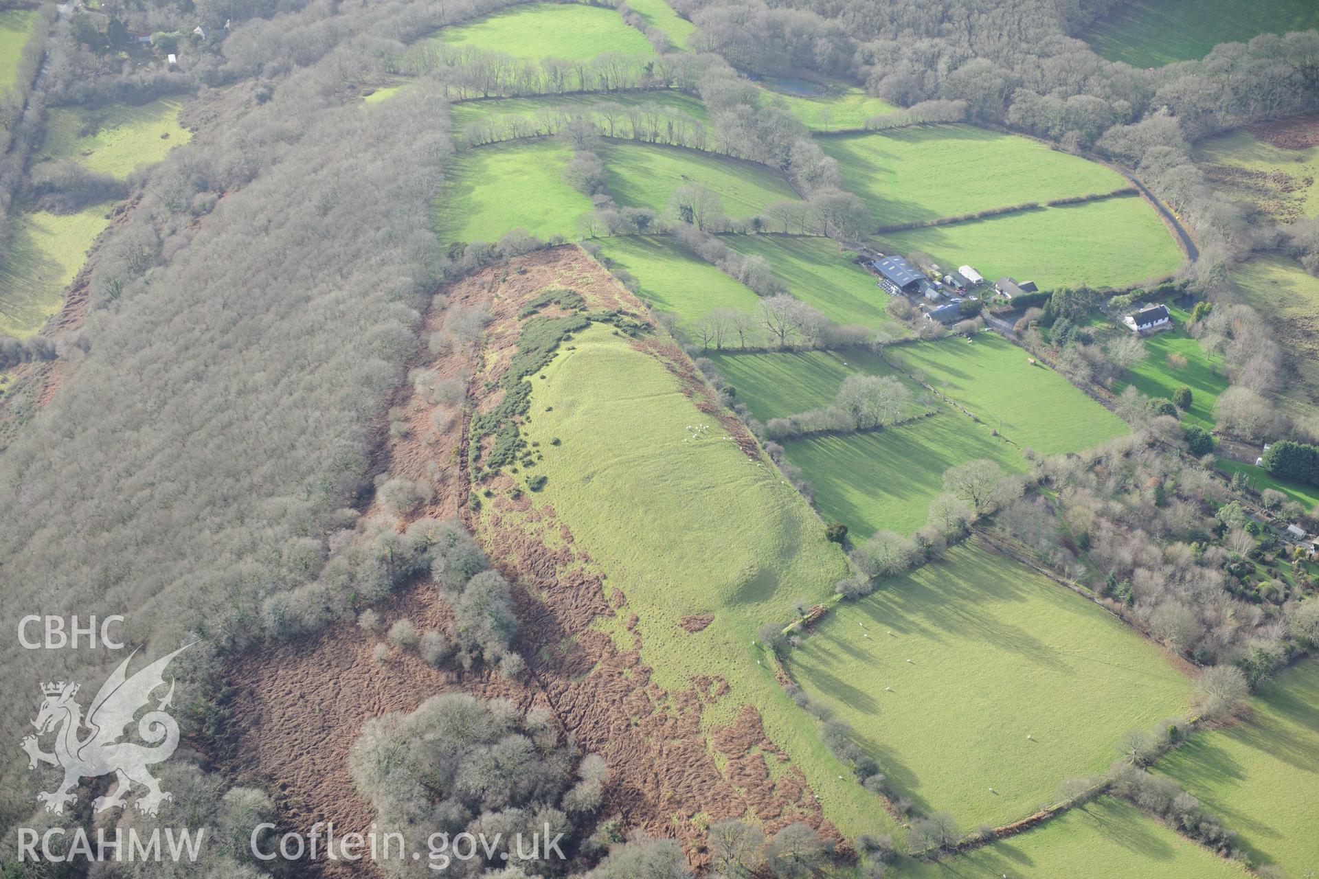 Pen-y-Gaer farm cottage and defended enclosure. Oblique aerial photograph taken during the Royal Commission's programme of archaeological aerial reconnaissance by Toby Driver on 6th January 2015.