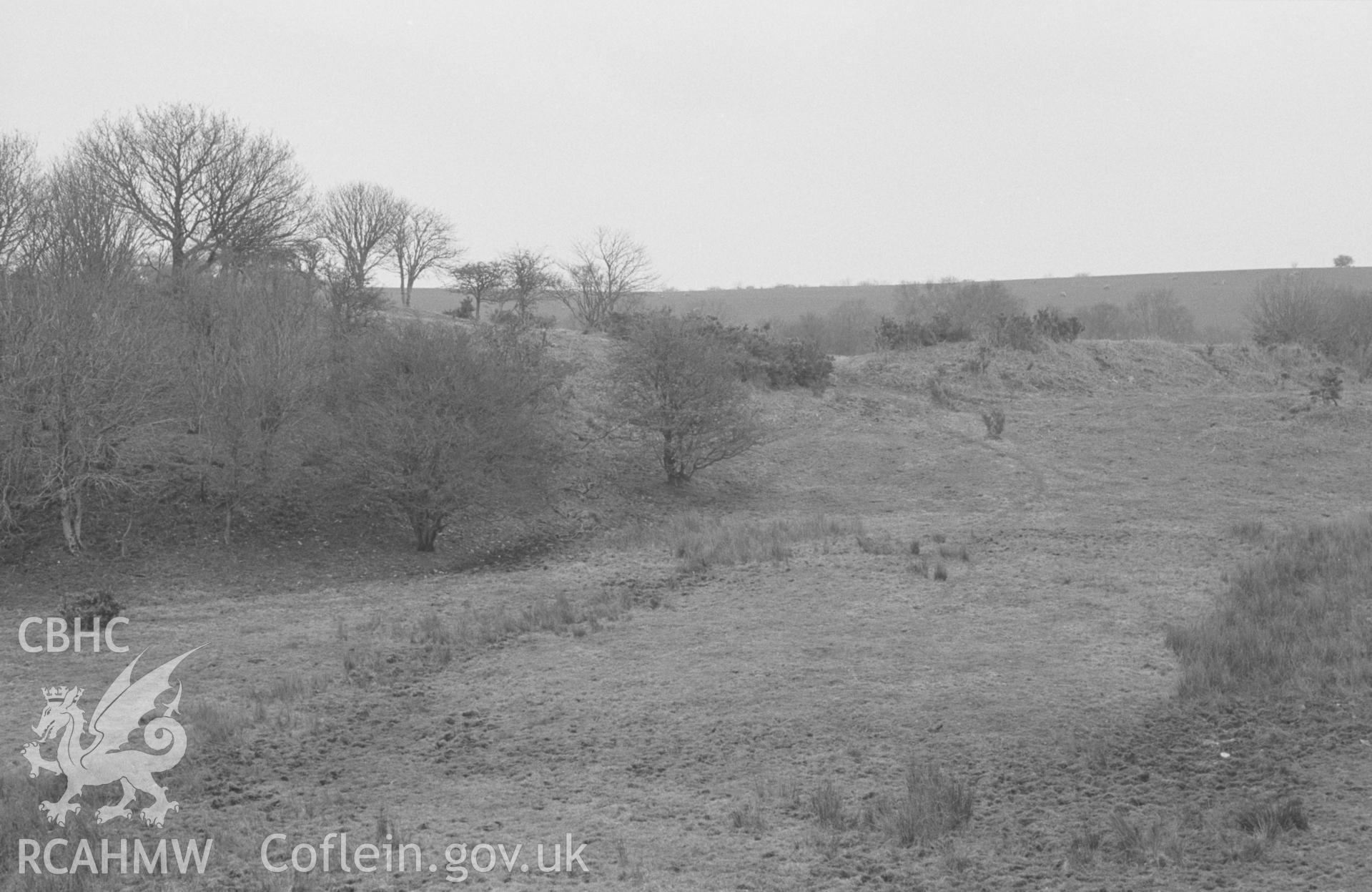 Digital copy of a black and white negative showing Cwm Castell, Mydriolyn, south east of New Quay. Photographed in April 1964 by Arthur O. Chater from Grid Reference SN 4692 5534, looking north-south east. Panorama, 2 of 3 photos.