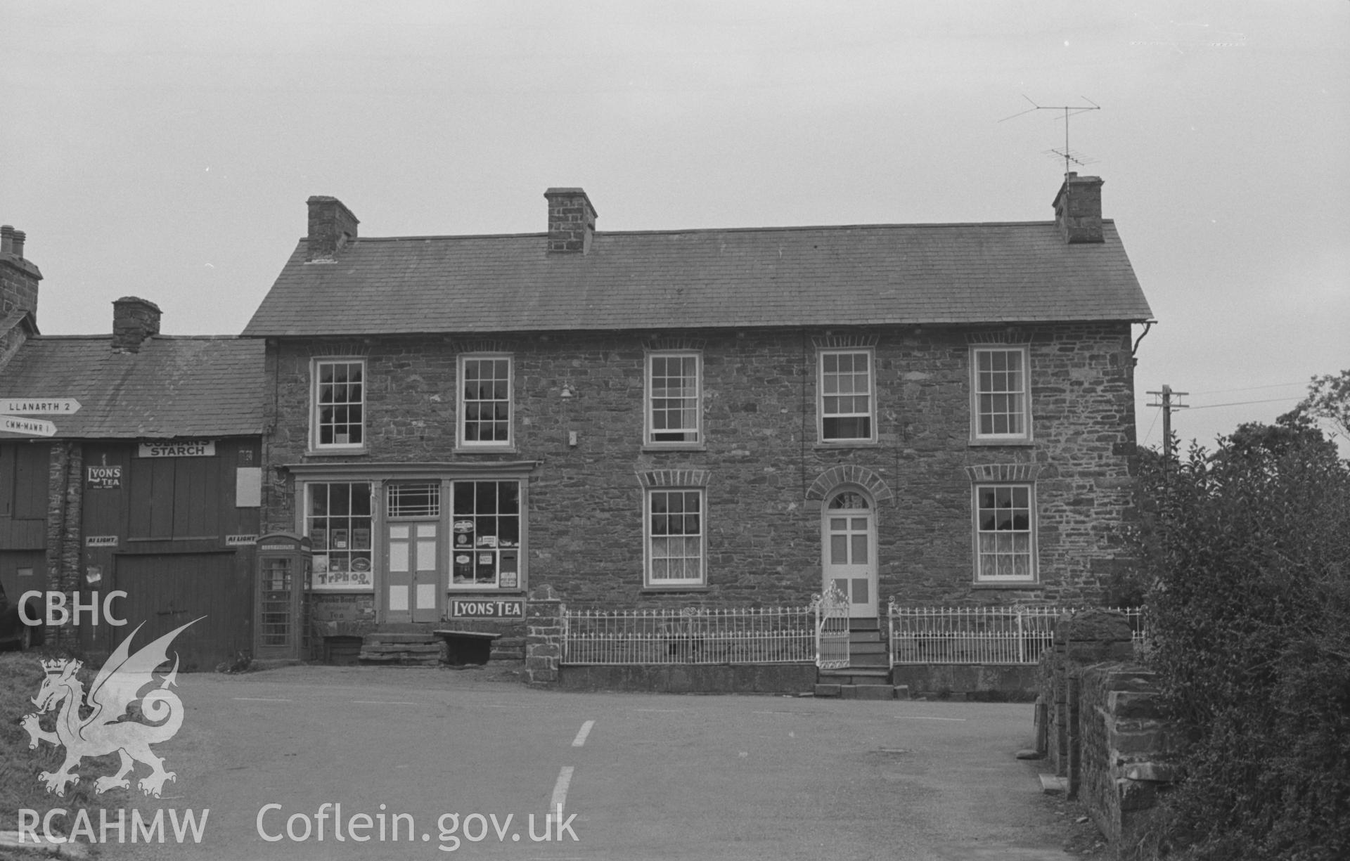 Digital copy of a black and white negative showing Post Office and house in the north angle of crossroads at Oakford, Aberaeron. Photographed by Arthur O. Chater on 5th September 1966 looking south east from Grid Reference SN 452 580.