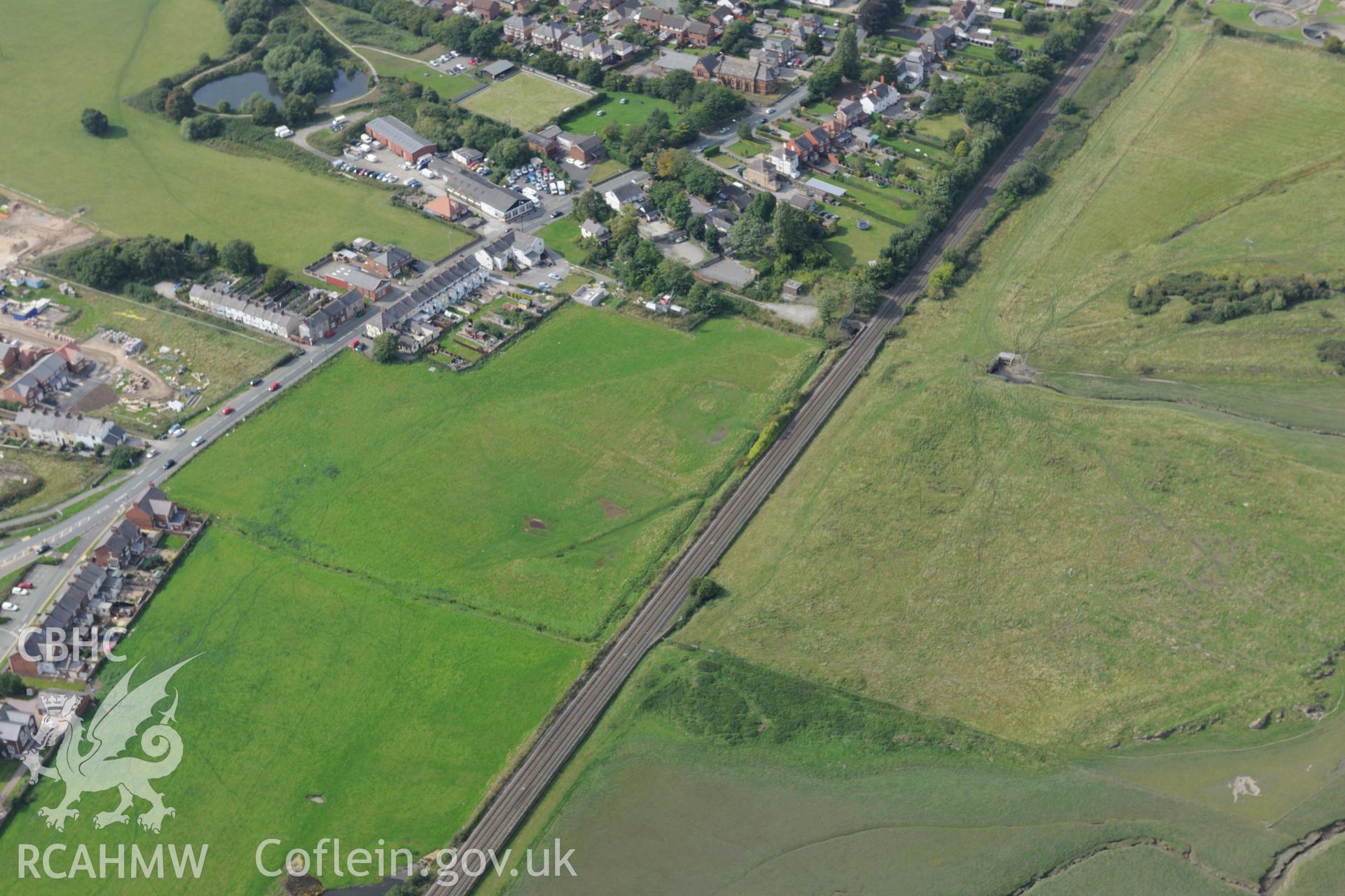 Pentre Bridge Roman settlement and new housing development- Bennet's Row, Flint. Oblique aerial photograph taken during the Royal Commission's programme of archaeological aerial reconnaissance by Toby Driver on 11th September 2015.