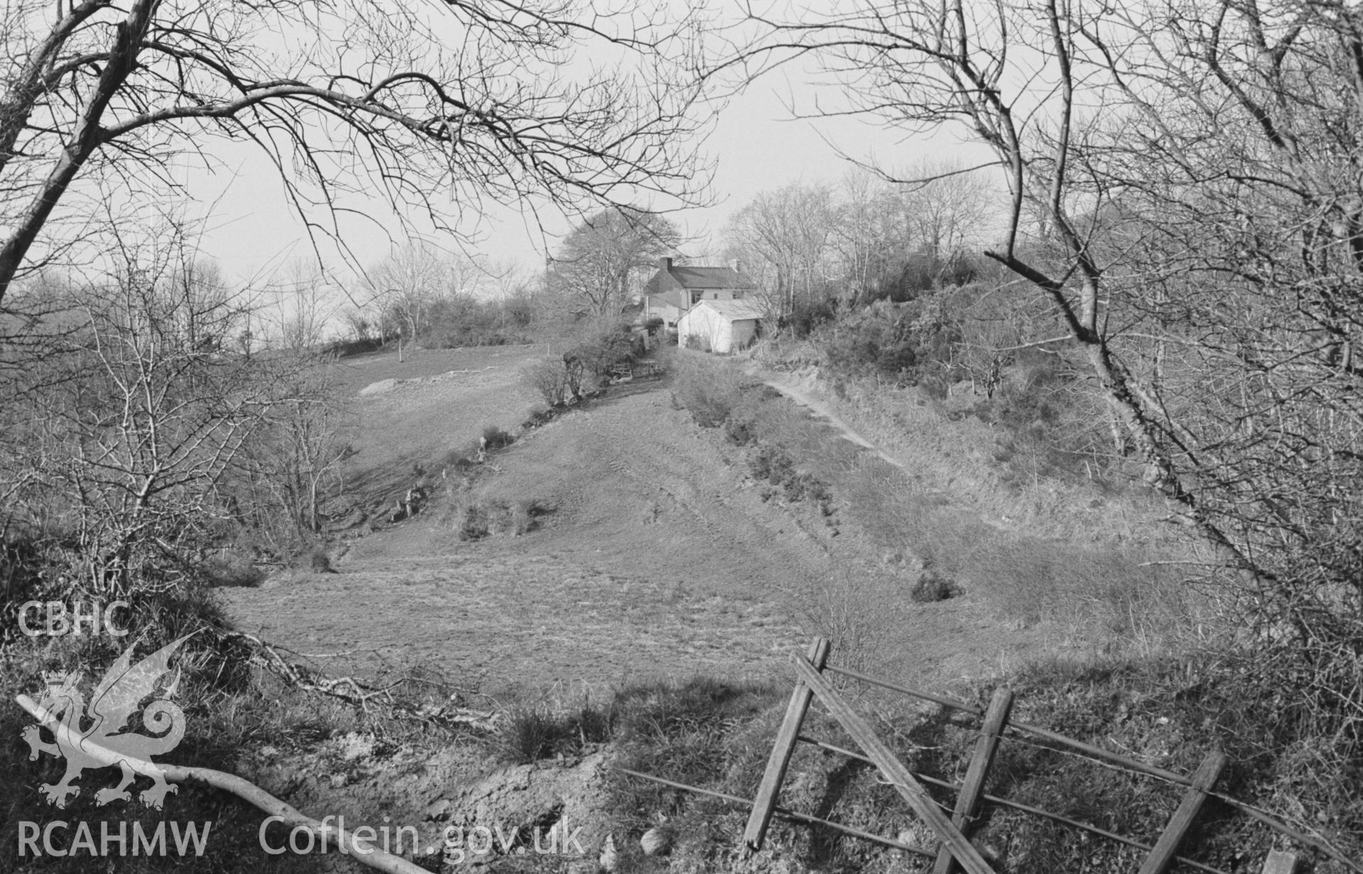 Digital copy of a black and white negative looking across the Afon Soden to farm opposite Hafodiwan. Photographed by Arthur O. Chater on 11th April 1968 looking north from Grid Reference SN 384 549.