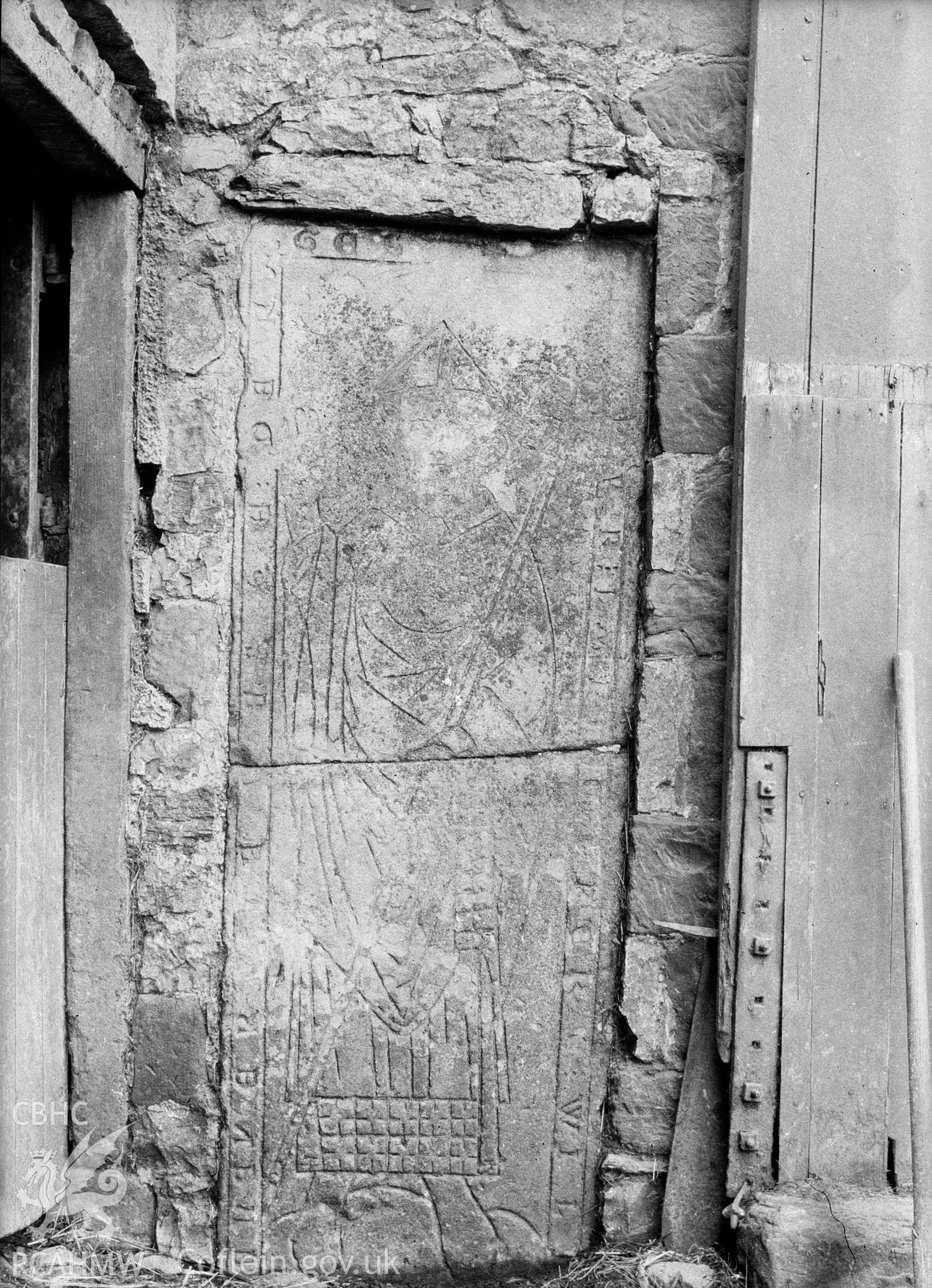 Digital copy of a nitrate negative showing view of inscribed stones in vicarage wall at the Friary near Rhuddlan Church,  taken by Leonard Monroe.