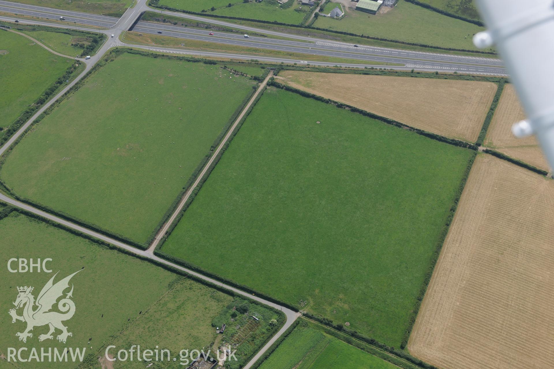 Site of Capel Eithin, Gaerwen, west of Llanfair PG, Anglesey. Oblique aerial photograph taken during the Royal Commission?s programme of archaeological aerial reconnaissance by Toby Driver on 12th July 2013.