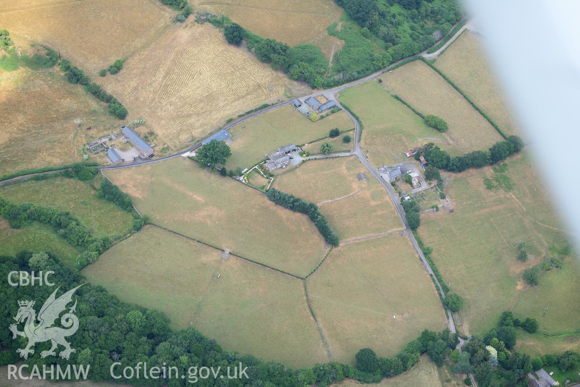 Royal Commission aerial photography of extensive parchmarks at Pen y Gaer Roman fort, including the internal plan and extramural buildings, taken on 19th July 2018 during the 2018 drought.