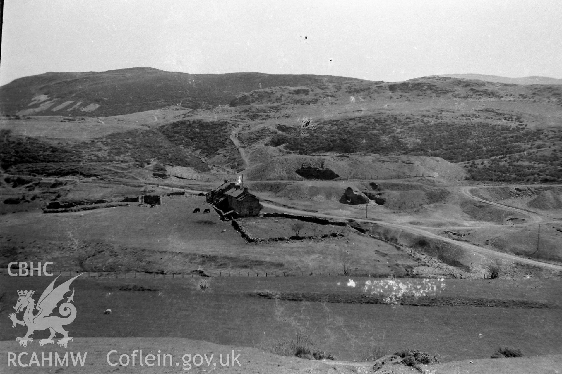 Digitised black & white photograph of Ystumtuen lead mine and dwellings. Produced during a Bachelor of Architecture dissertation entitled: 'The Form and Architecture of Nineteenth Century Industrial Settlements in Rural Wales' by Martin Davies, 1979.