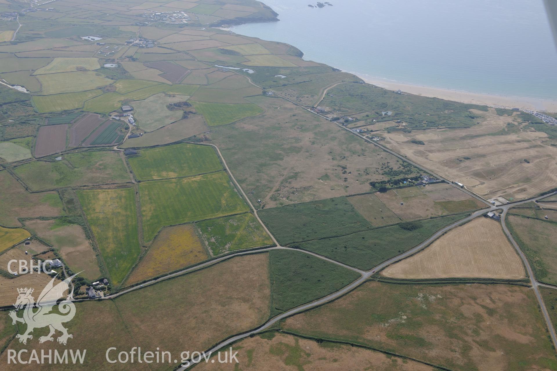 Parchmarks of possible township at Croes Phillip, St Davids. Oblique aerial photograph taken during the Royal Commission?s programme of archaeological aerial reconnaissance by Toby Driver on 16th July 2013.