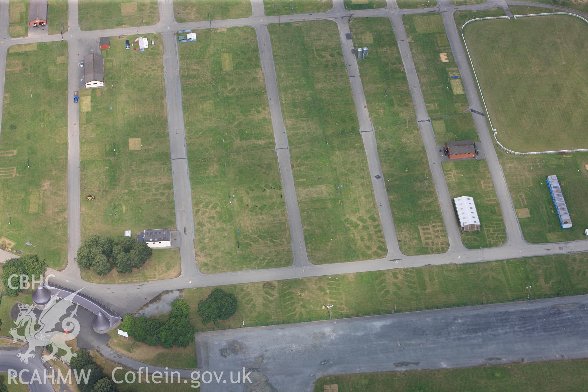 The Royal Welsh Showground, Llanelwedd. Oblique aerial photograph taken during the Royal Commission?s programme of archaeological aerial reconnaissance by Toby Driver on 1st August 2013.