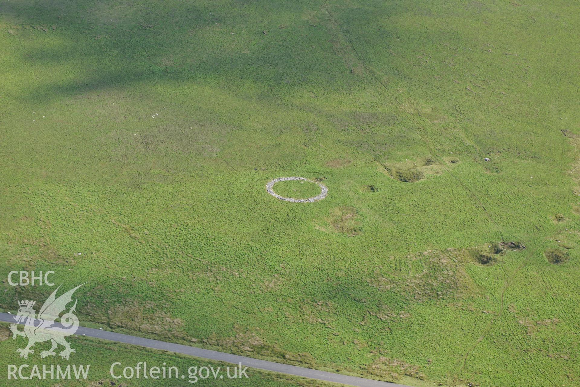 Cefn Sychbant ring cairn, north west of Merthyr Tydfil. Oblique aerial photograph taken during the Royal Commission?s programme of archaeological aerial reconnaissance by Toby Driver on 1st August 2013.