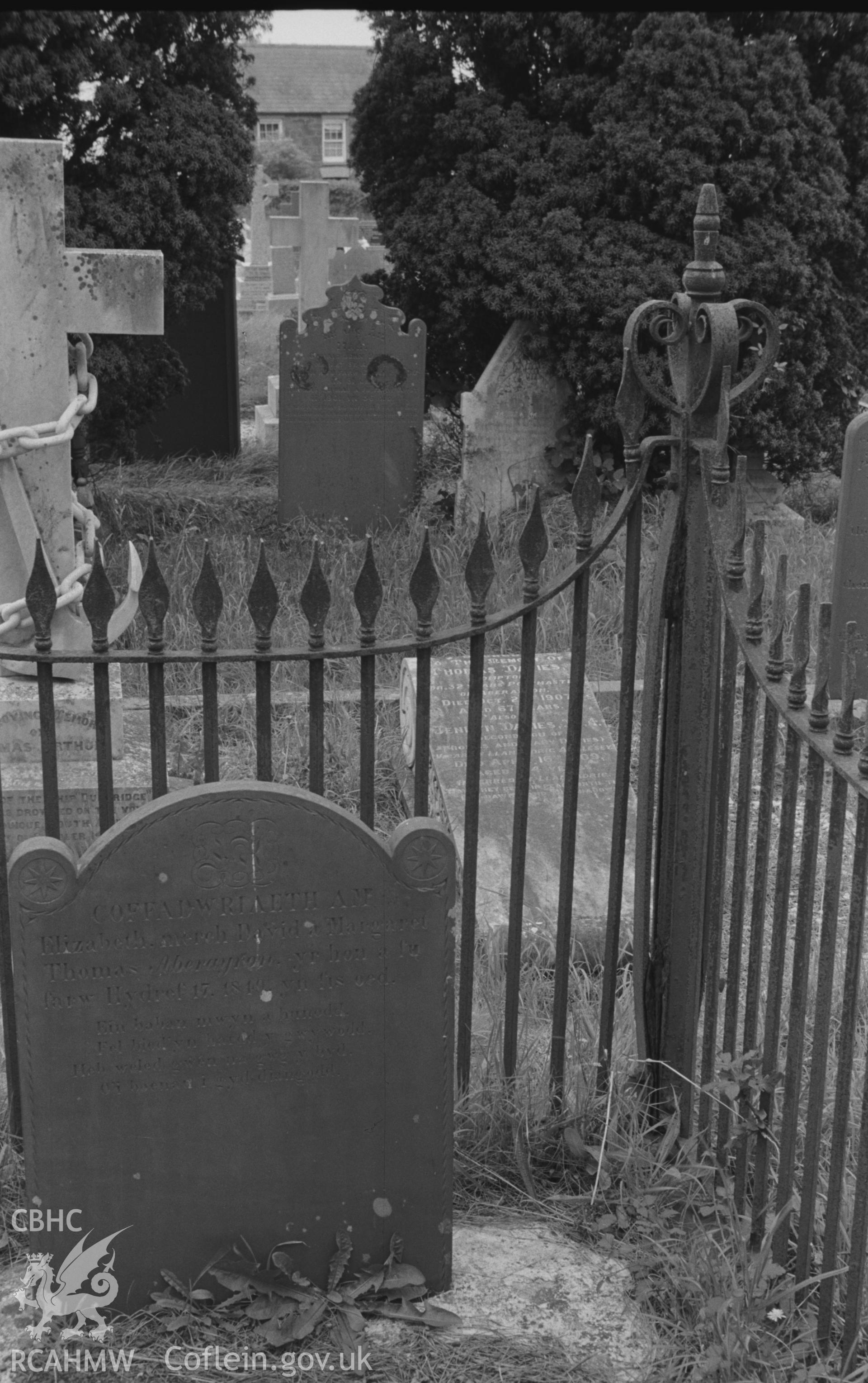 Digital copy of a black and white negative showing iron grave enclosure around grave of 1849 at St. David's Church, Henfynyw, Aberaeron. Photographed by Arthur O. Chater on 5th September 1966 from Grid Reference SN 447 613.