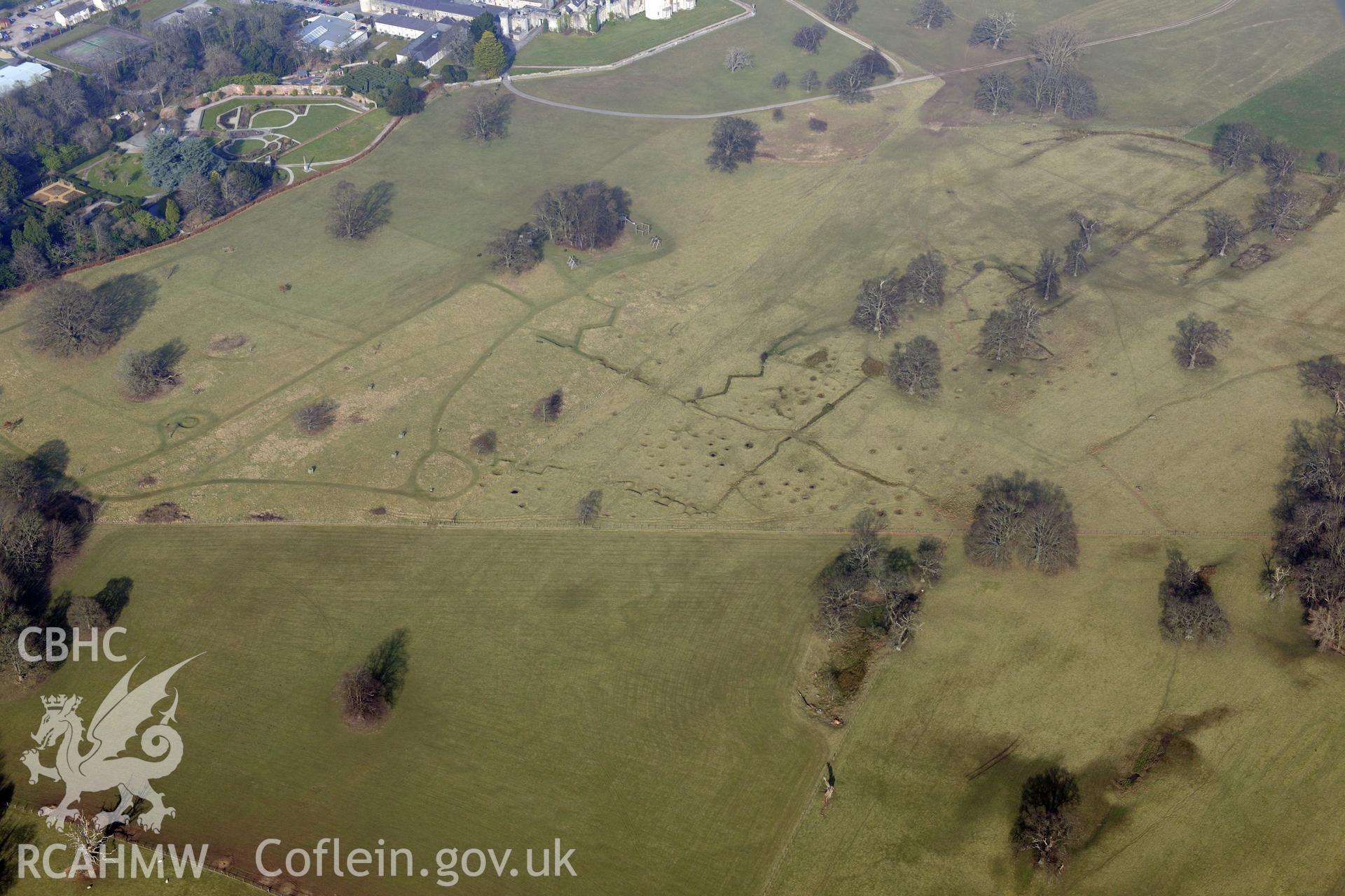Bodelwyddan Castle garden, and Bodelwyddan Park army practise trenches, west of St. Asaph. Oblique aerial photograph taken during the Royal Commission?s programme of archaeological aerial reconnaissance by Toby Driver on 28th February 2013.
