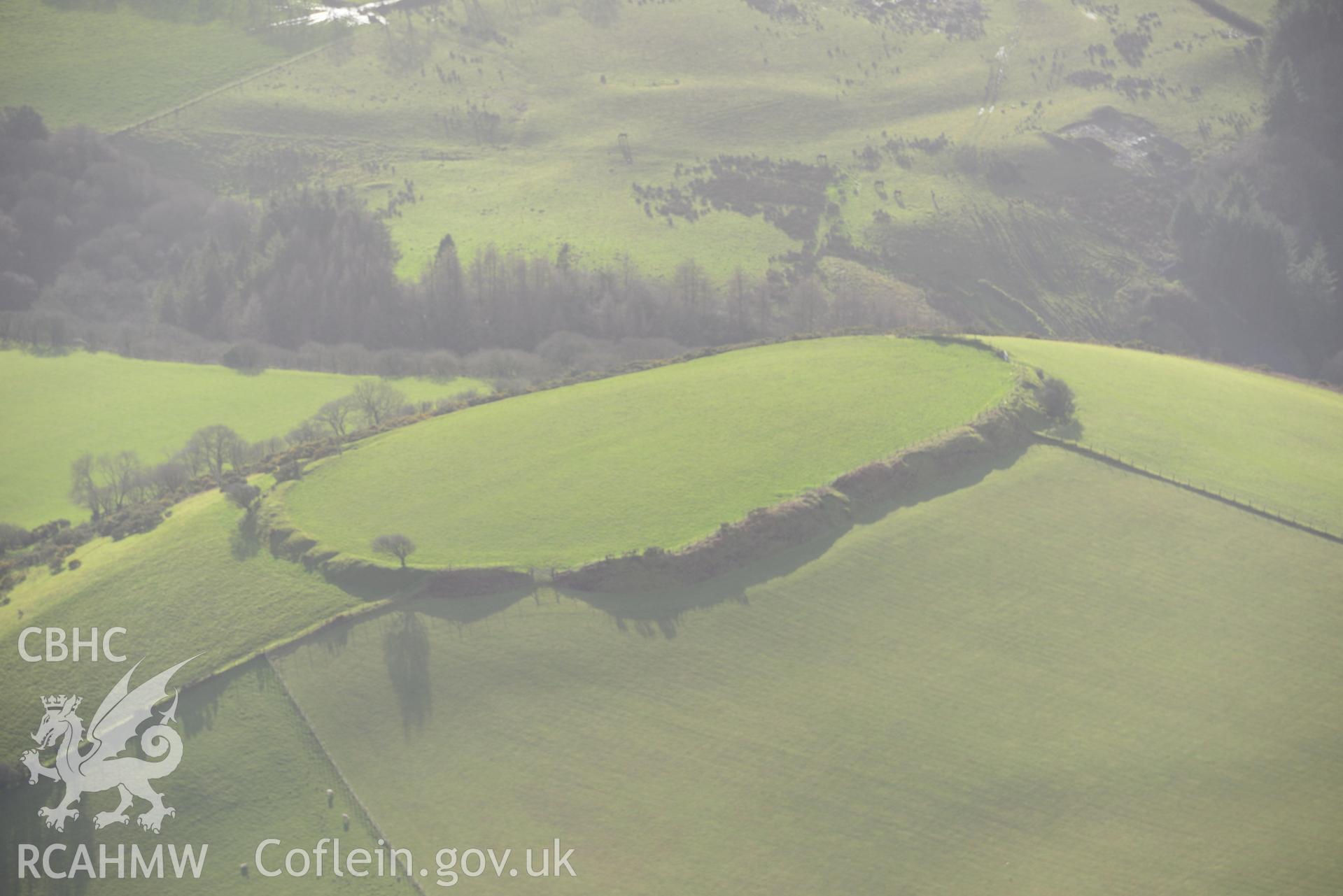 Castell Moedyn Defended Enclosure. Oblique aerial photograph taken during the Royal Commission's programme of archaeological aerial reconnaissance by Toby Driver on 6th January 2015