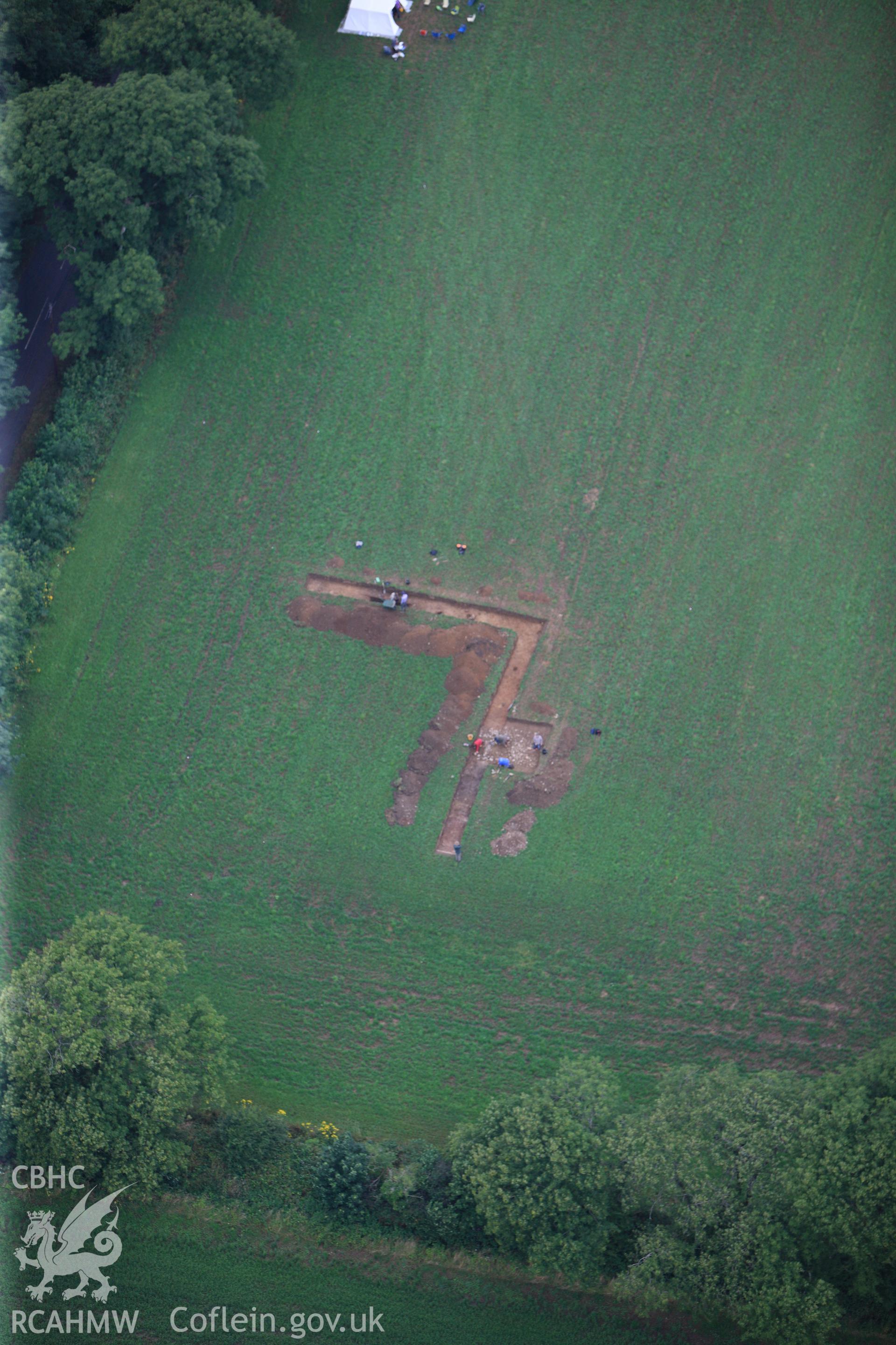 Wiston Roman Fort with excavations by Dyfed Archaeological Trust, north east of Haverfordwest. Oblique aerial photograph taken during the Royal Commission?s programme of archaeological aerial reconnaissance by Toby Driver on 1st August 2013.