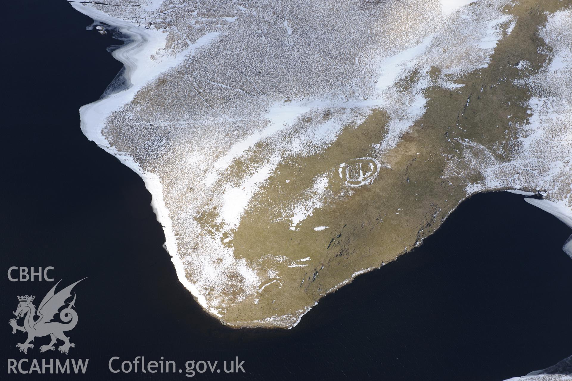 Enclosure and long house on shores of Llyn Gynon in the Cambrian Mountains, south east of Pontrhydfendigaid. Oblique aerial photograph taken during the Royal Commission's programme of archaeological aerial reconnaissance by Toby Driver on 2nd April 2013.