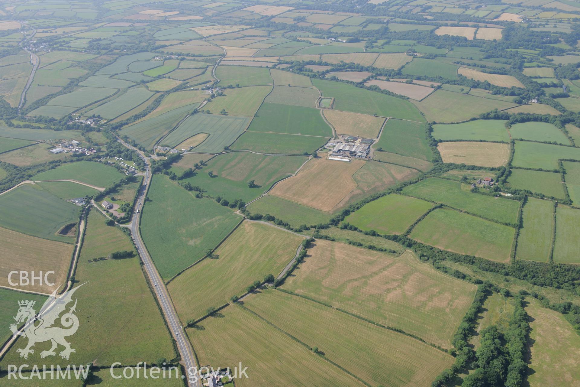 Pelcombe Rath defended enclosure north west of Haverford West. Oblique aerial photograph taken during the Royal Commission?s programme of archaeological aerial reconnaissance by Toby Driver on 16th July 2013.