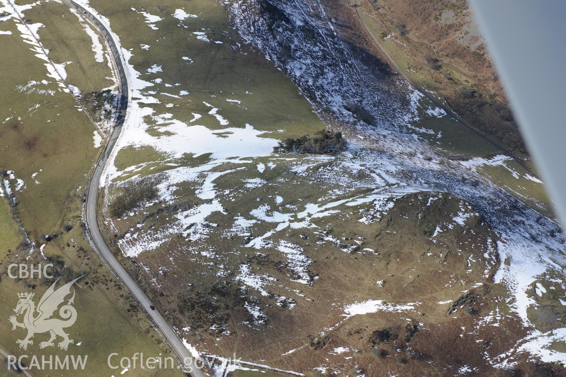 Pen-y-Clun hillfort or defended enclosure, south west of Trefeglwys. Oblique aerial photograph taken during the Royal Commission's programme of archaeological aerial reconnaissance by Toby Driver on 2nd April 2013.