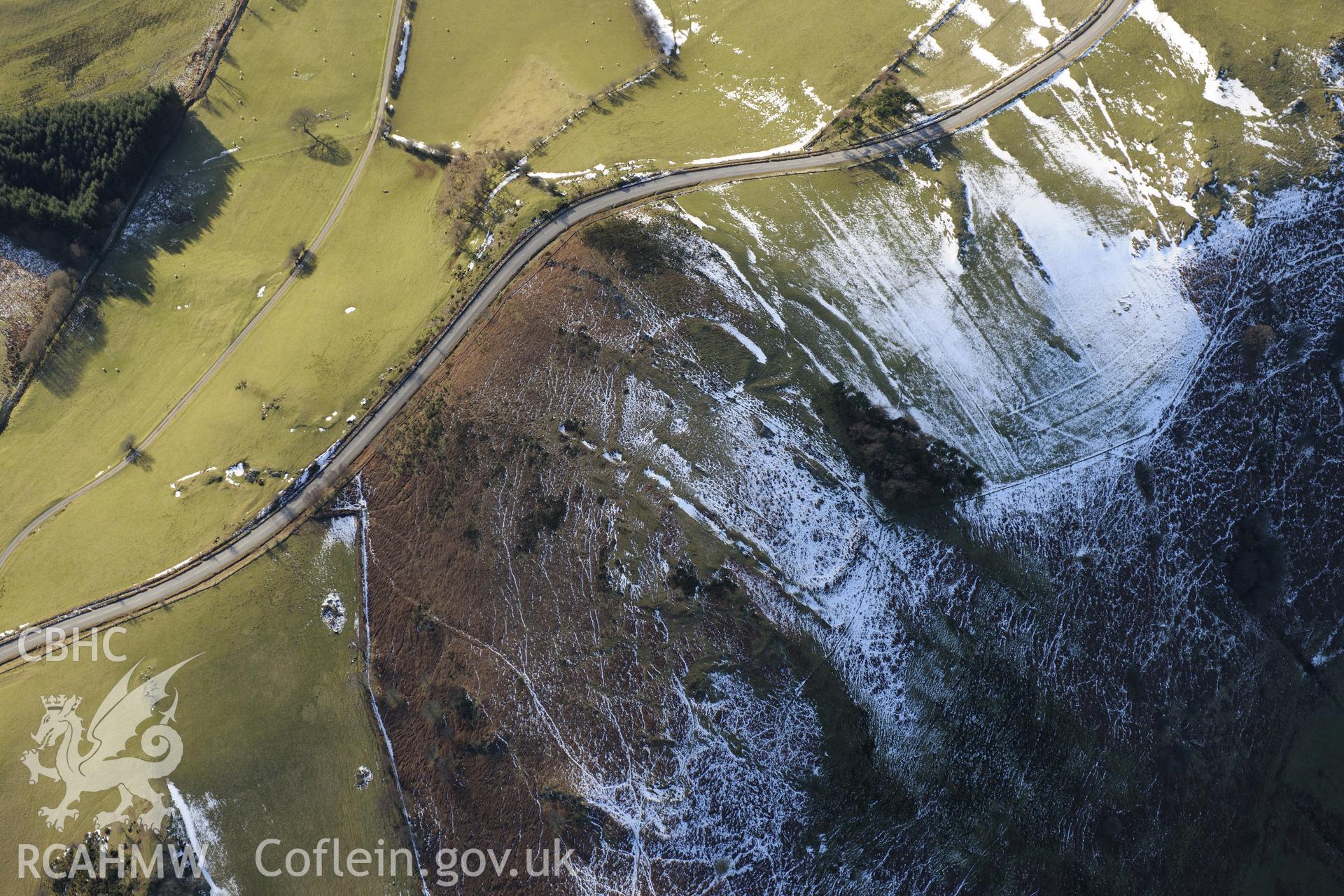 Pen-y-Clun hillfort east of Llyn Clywedog, Llanidloes. Oblique aerial photograph taken during the Royal Commission's programme of archaeological aerial reconnaissance by Toby Driver on 4th February 2015.