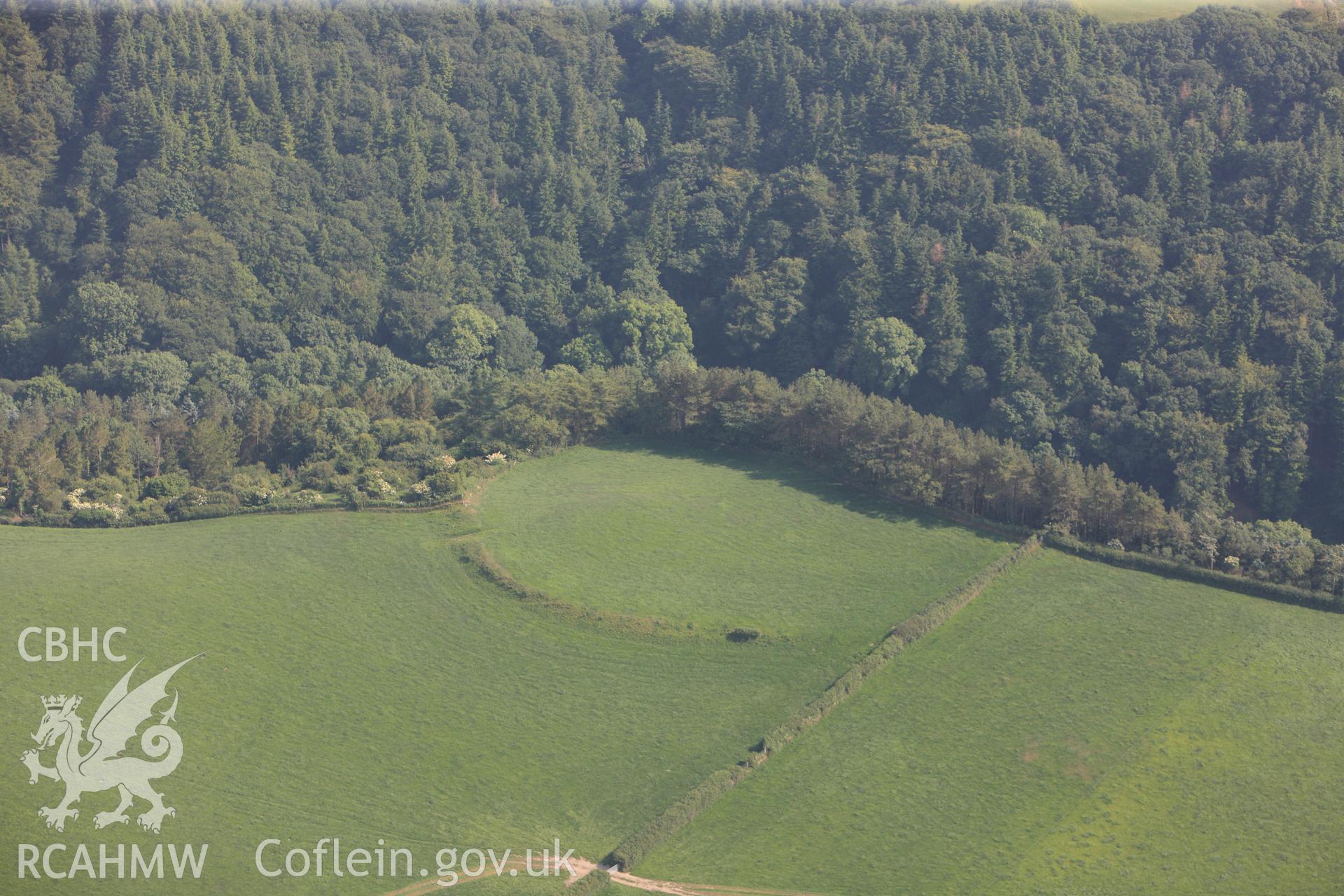 Gilfaech Hael defended enclosure, Llanrhystud. Oblique aerial photograph taken during the Royal Commission?s programme of archaeological aerial reconnaissance by Toby Driver on 12th July 2013.