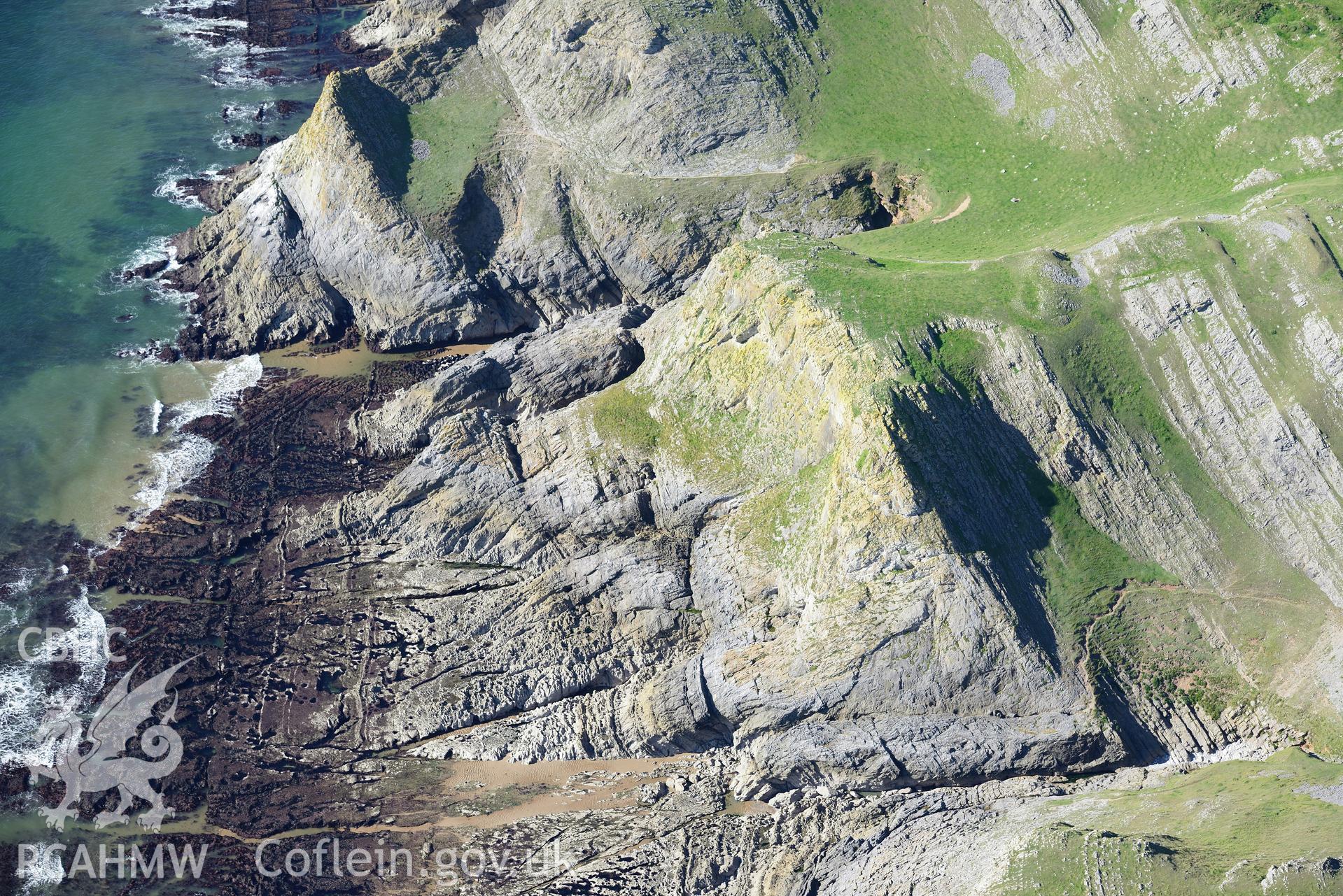 Horse Cliff promontory fort, on the south western shore of the Gower Peninsula. Oblique aerial photograph taken during the Royal Commission's programme of archaeological aerial reconnaissance by Toby Driver on 30th September 2015.