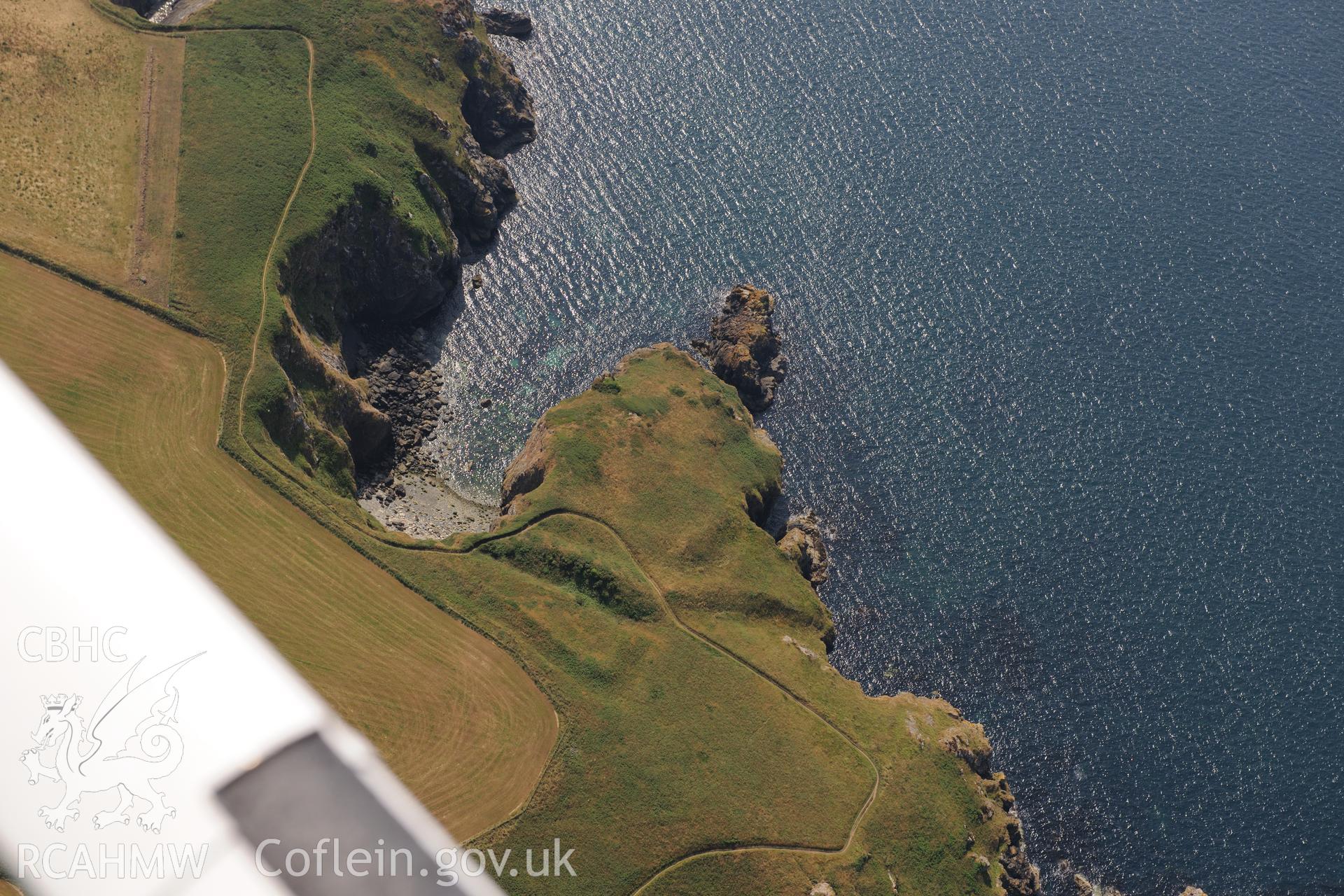 Howney Stone Rath defended enclosure, west of Little Haven on the Pembrokeshire coast. Oblique aerial photograph taken during the Royal Commission?s programme of archaeological aerial reconnaissance by Toby Driver on 16th July 2013.