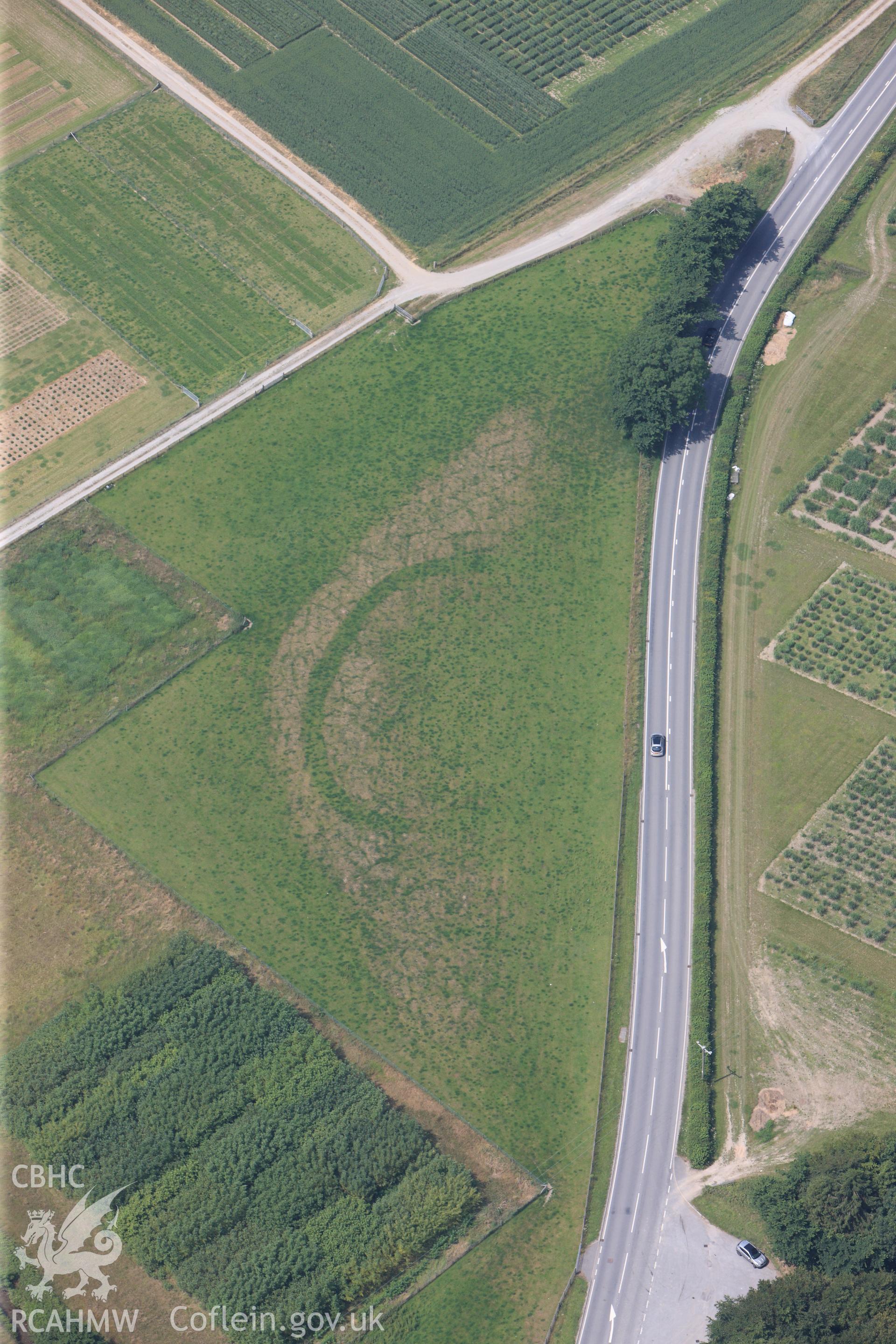 Gogerddan Enclosure, on the southern outskirts of Bow Street, Aberystwyth. Oblique aerial photograph taken during the Royal Commission?s programme of archaeological aerial reconnaissance by Toby Driver on 12th July 2013.