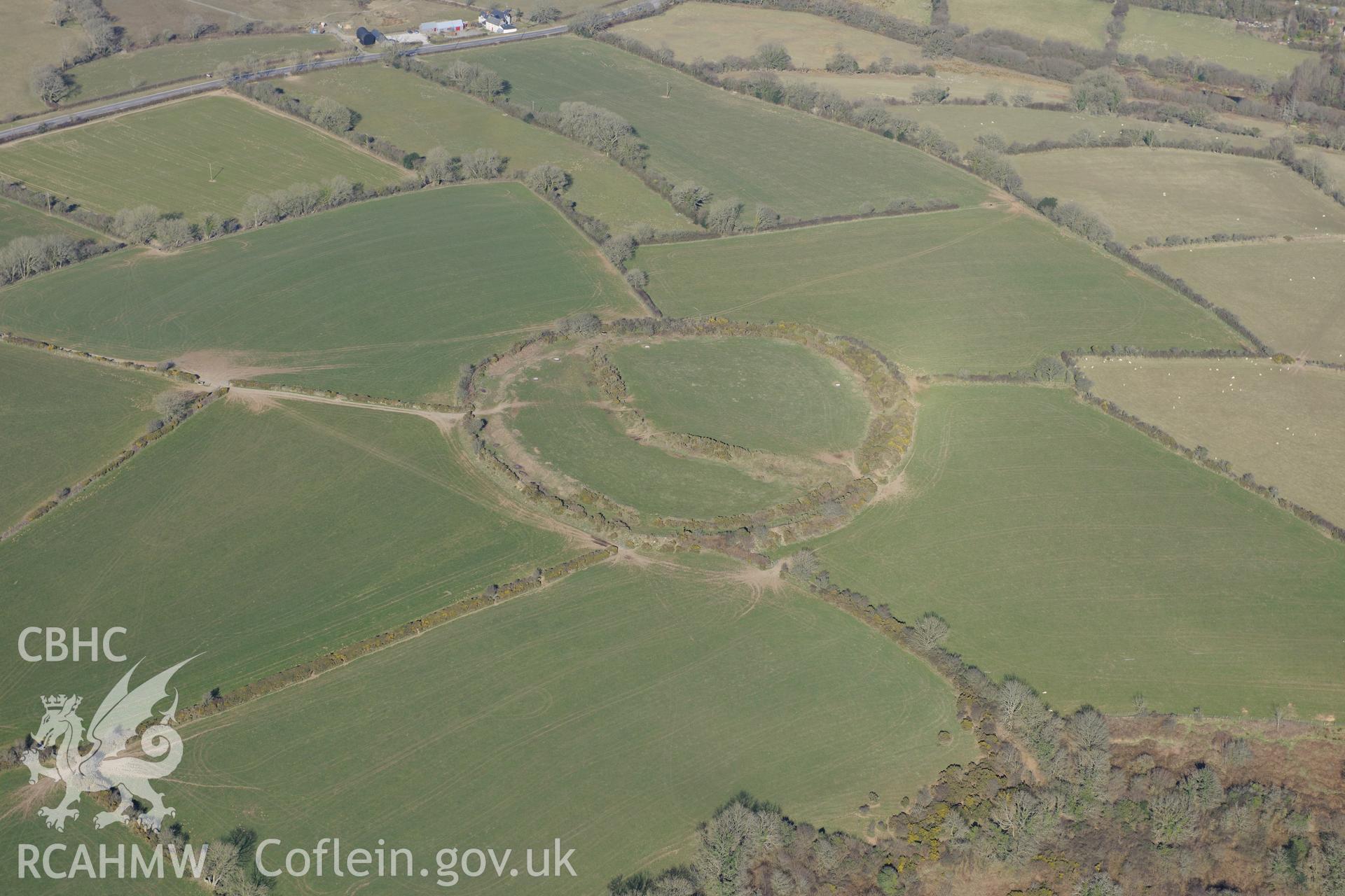 Castell Mawr henge or hillfort, Eglwyswrw, south west of Cardigan. Oblique aerial photograph taken during the Royal Commission's programme of archaeological aerial reconnaissance by Toby Driver on 2nd April 2013.