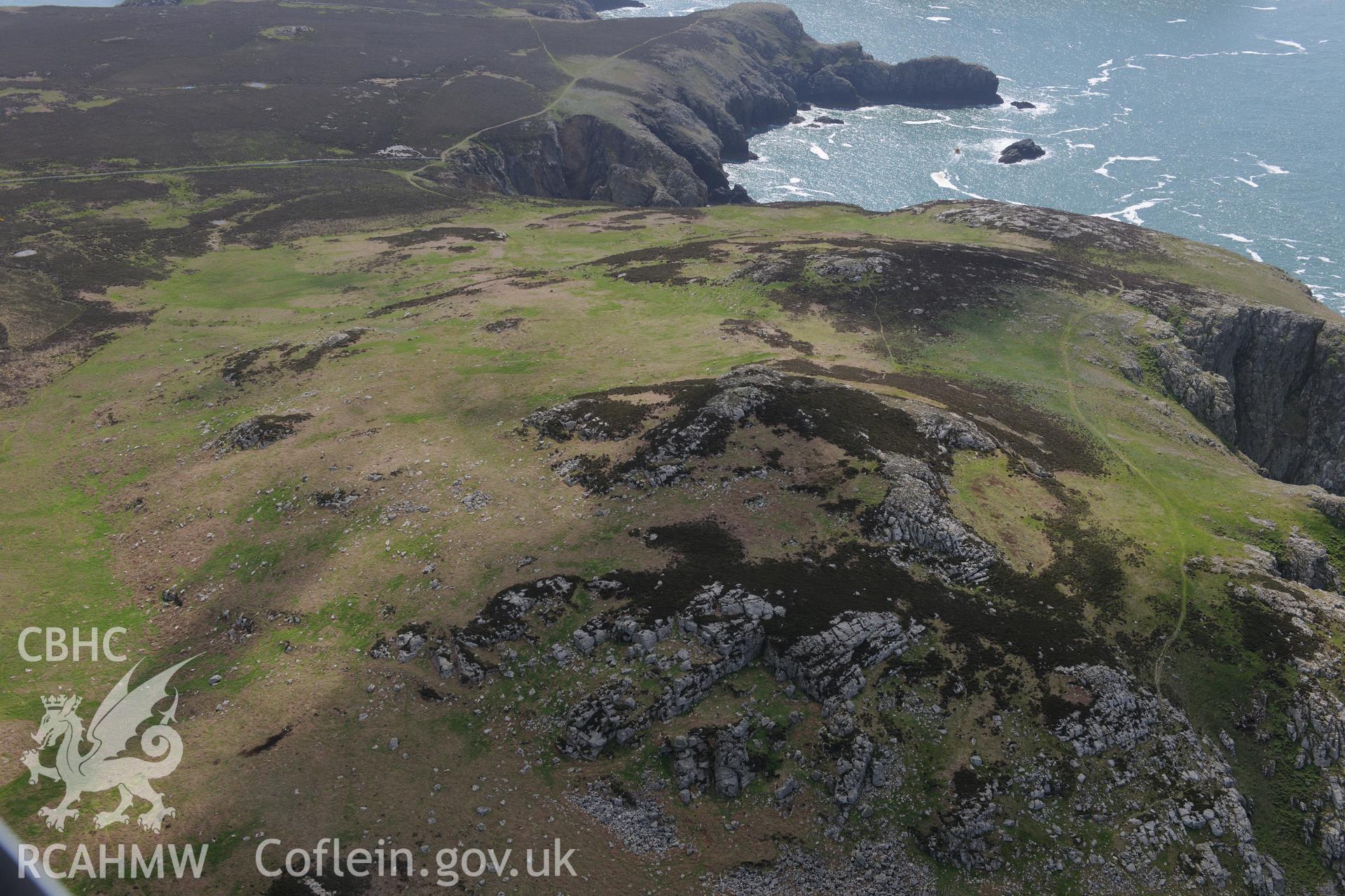 Carn Llundain and its relict field walls on Ramsey Island. Oblique aerial photograph taken during the Royal Commission's programme of archaeological aerial reconnaissance by Toby Driver on 13th May 2015.