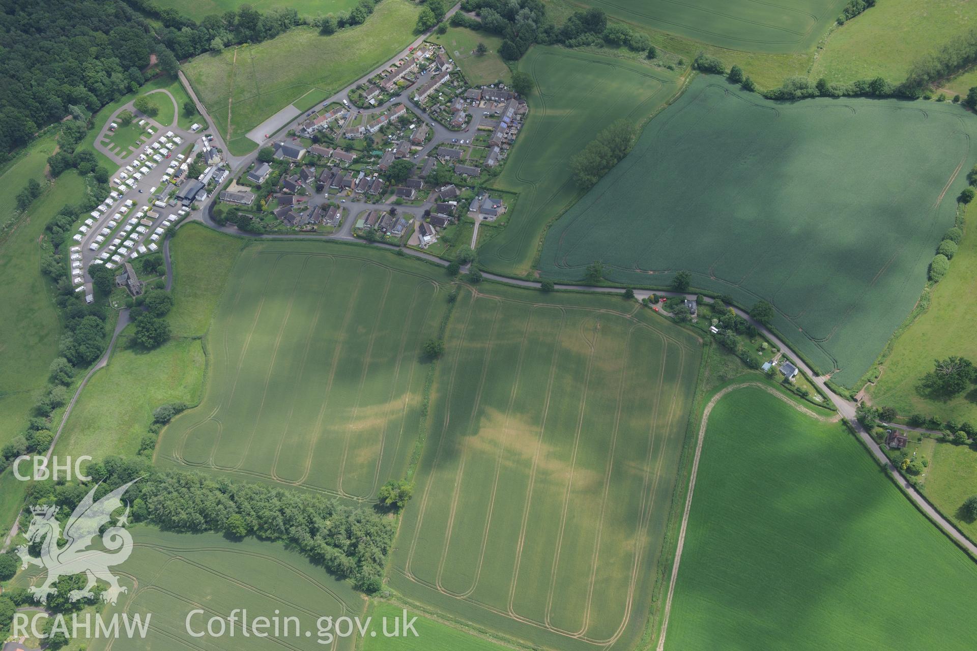 The village of Dingestow and the site of Dingestow Castle. Oblique aerial photograph taken during the Royal Commission's programme of archaeological aerial reconnaissance by Toby Driver on 29th June 2015.