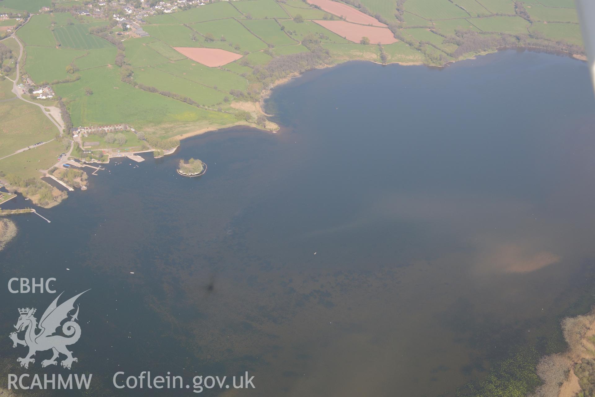 The Welsh Crannog Centre, Llangors Lake and Llangors, Crannog. Oblique aerial photograph taken during the Royal Commission's programme of archaeological aerial reconnaissance by Toby Driver on 21st April 2015